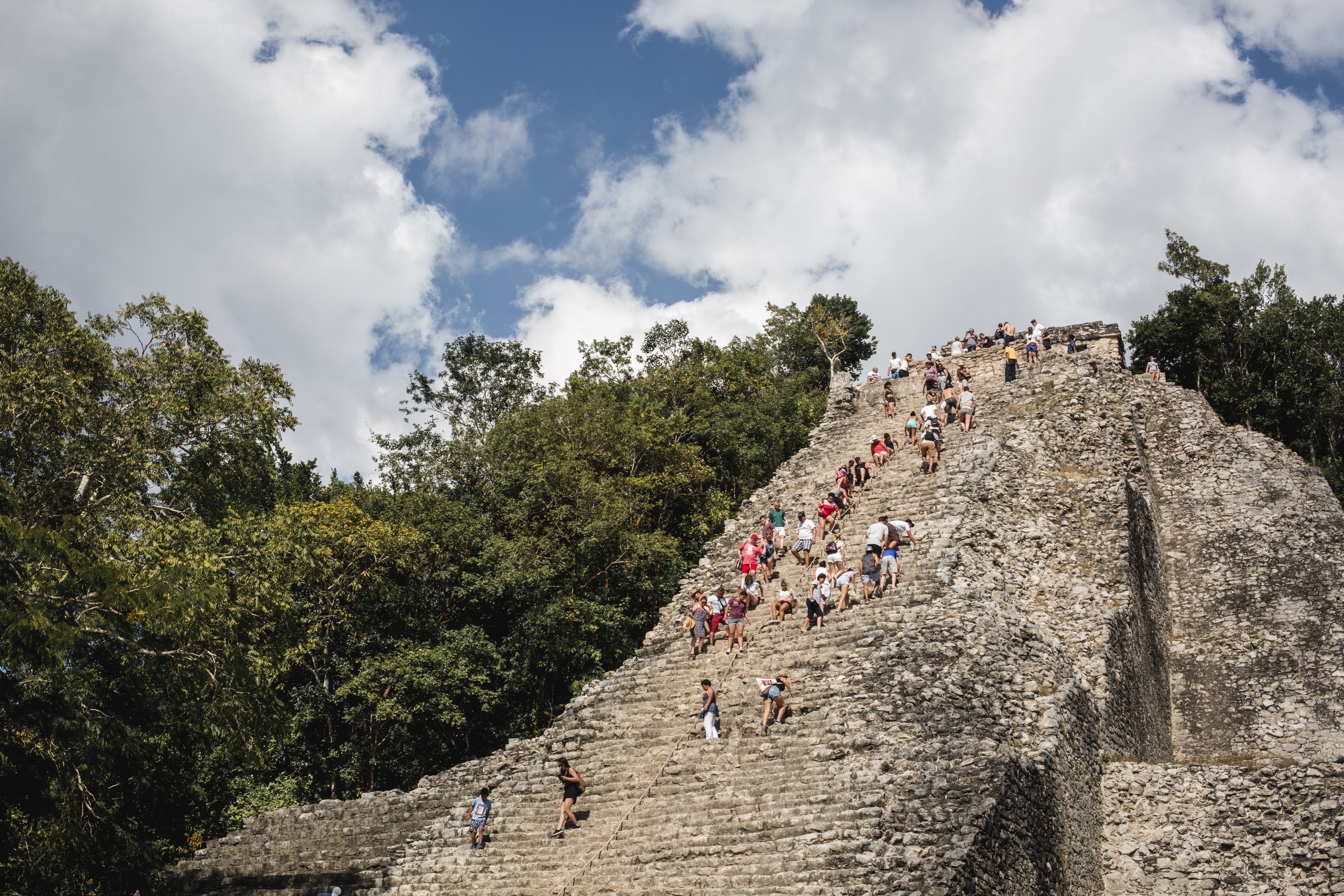 Tourists Boldly Climb Ancient Mexican Ruins: Stunning Photo