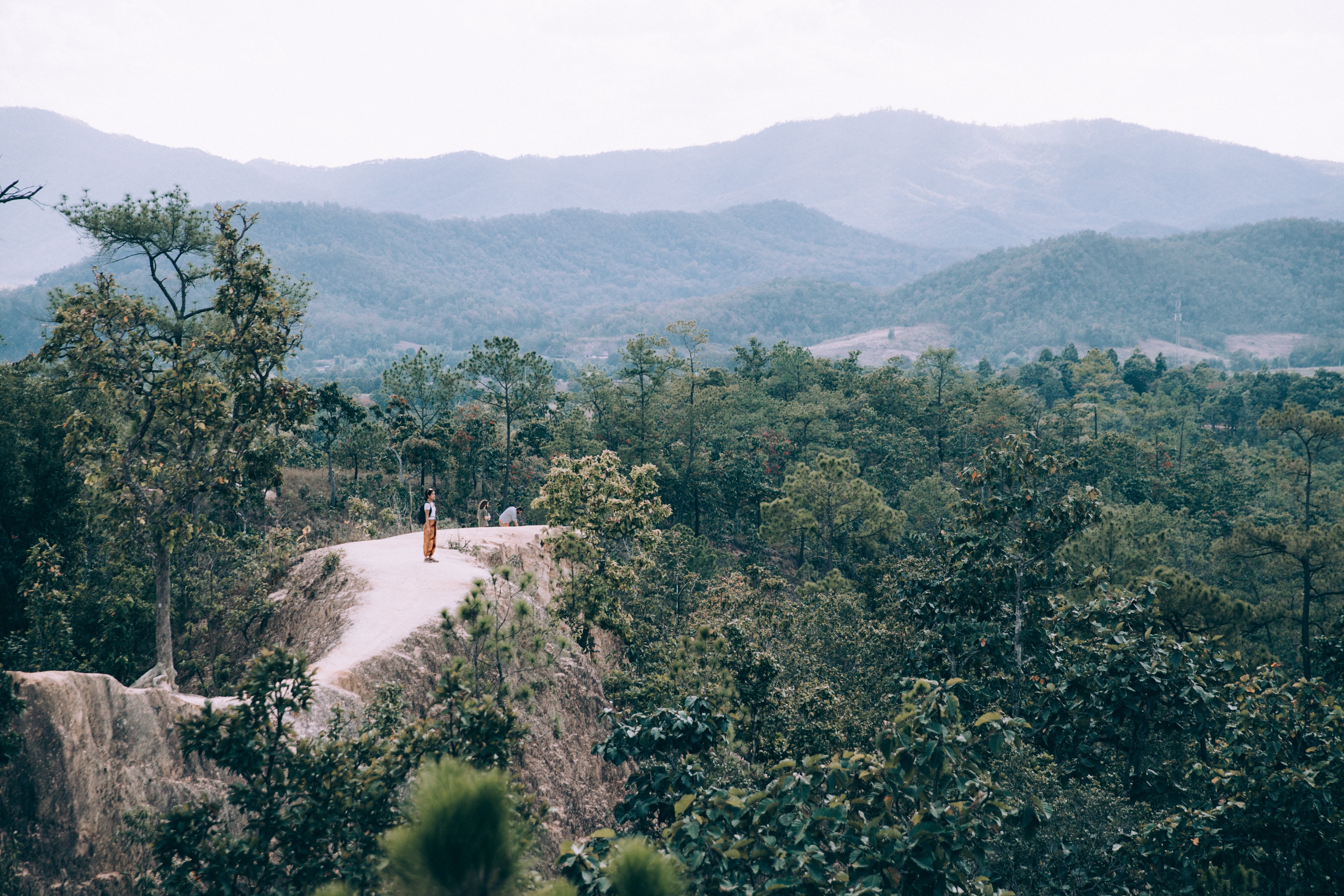 Woman in Awe: Breathtaking Valley View Landscape Photo