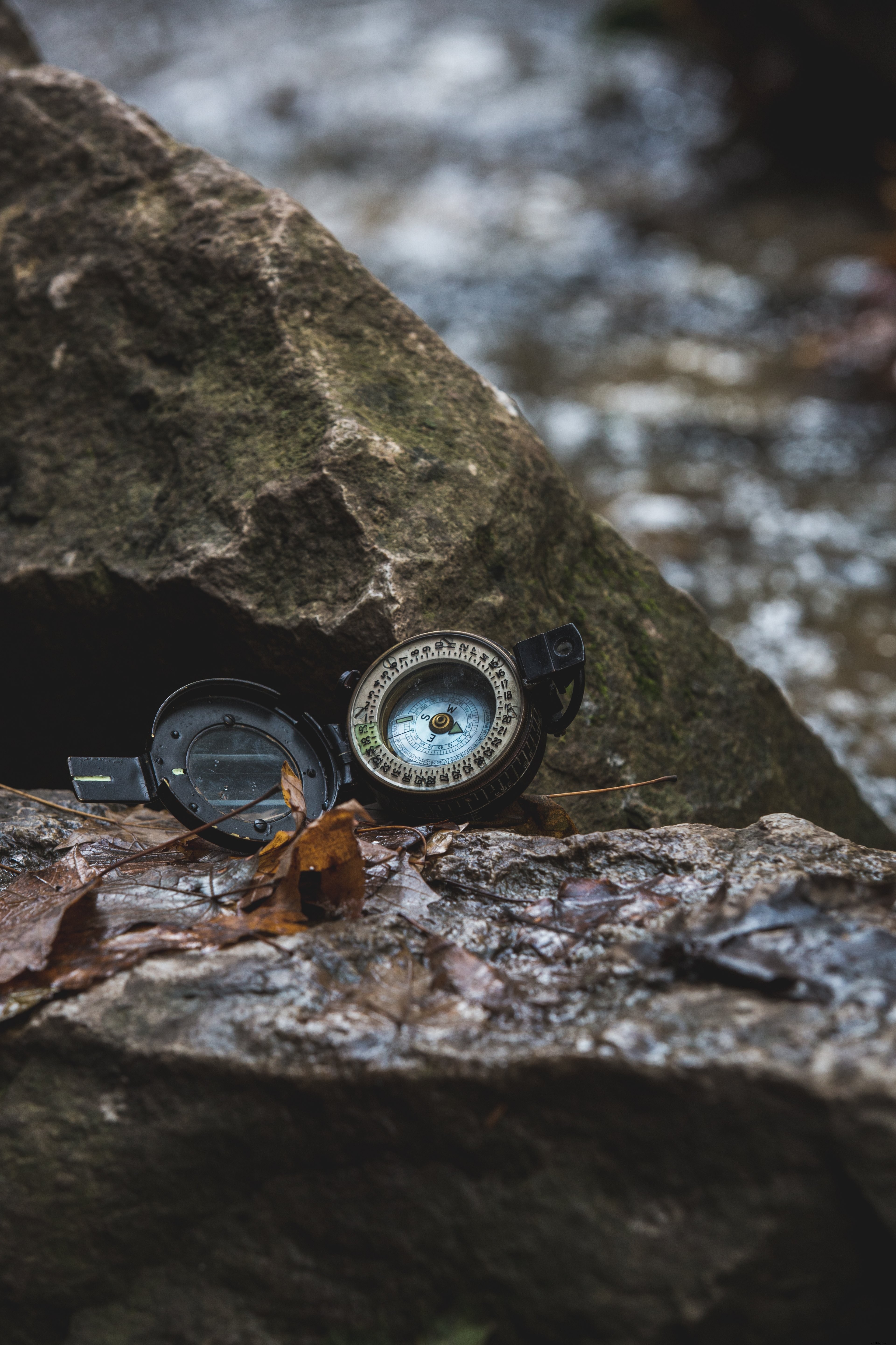 Stunning Photo: Open Compass Resting on Rugged Rocks