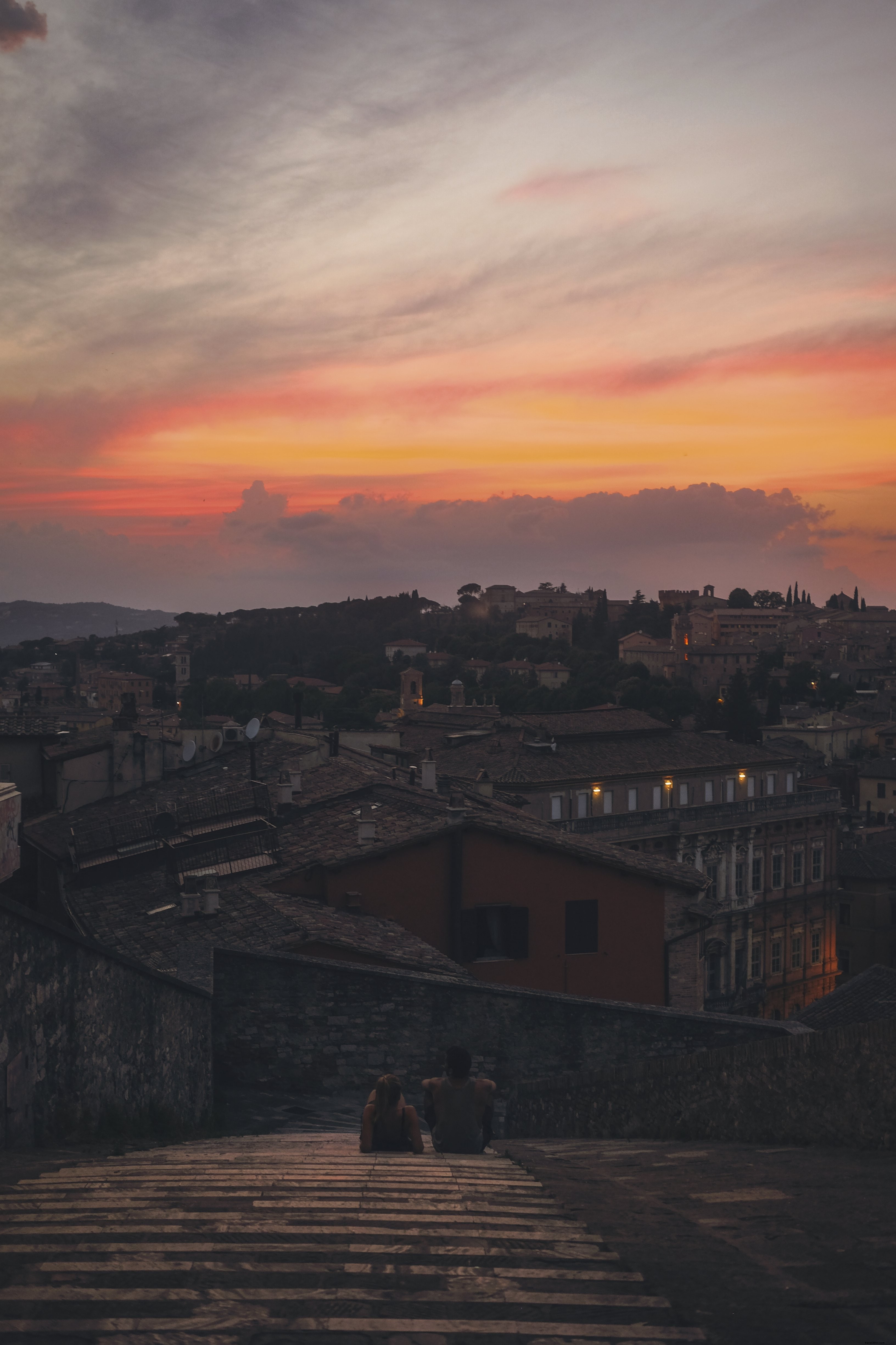 Stunning Evening Sunset: Two People Perched High Enjoying the View