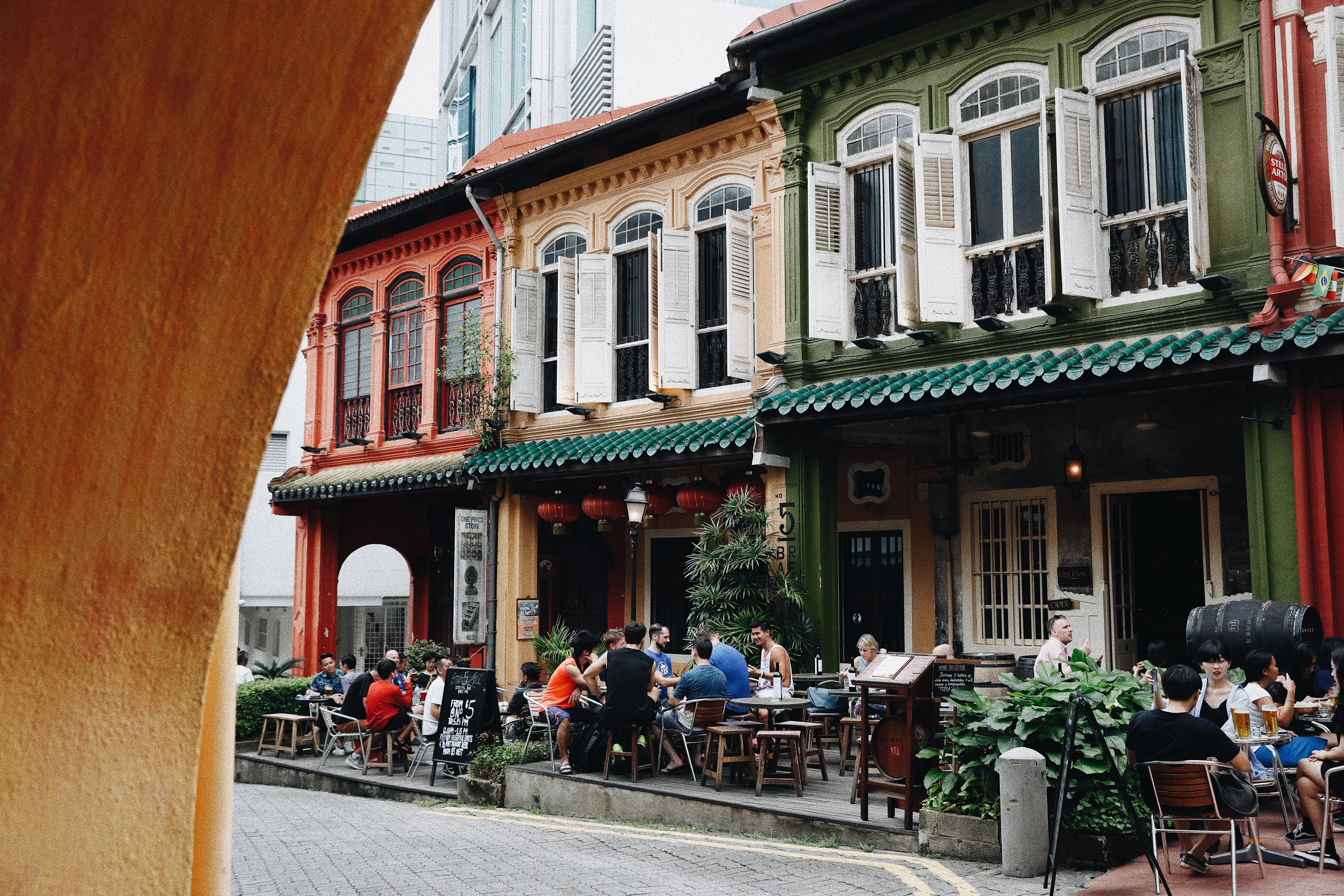 Vibrant Photo: People Relaxing with Drinks on a Sunny Patio