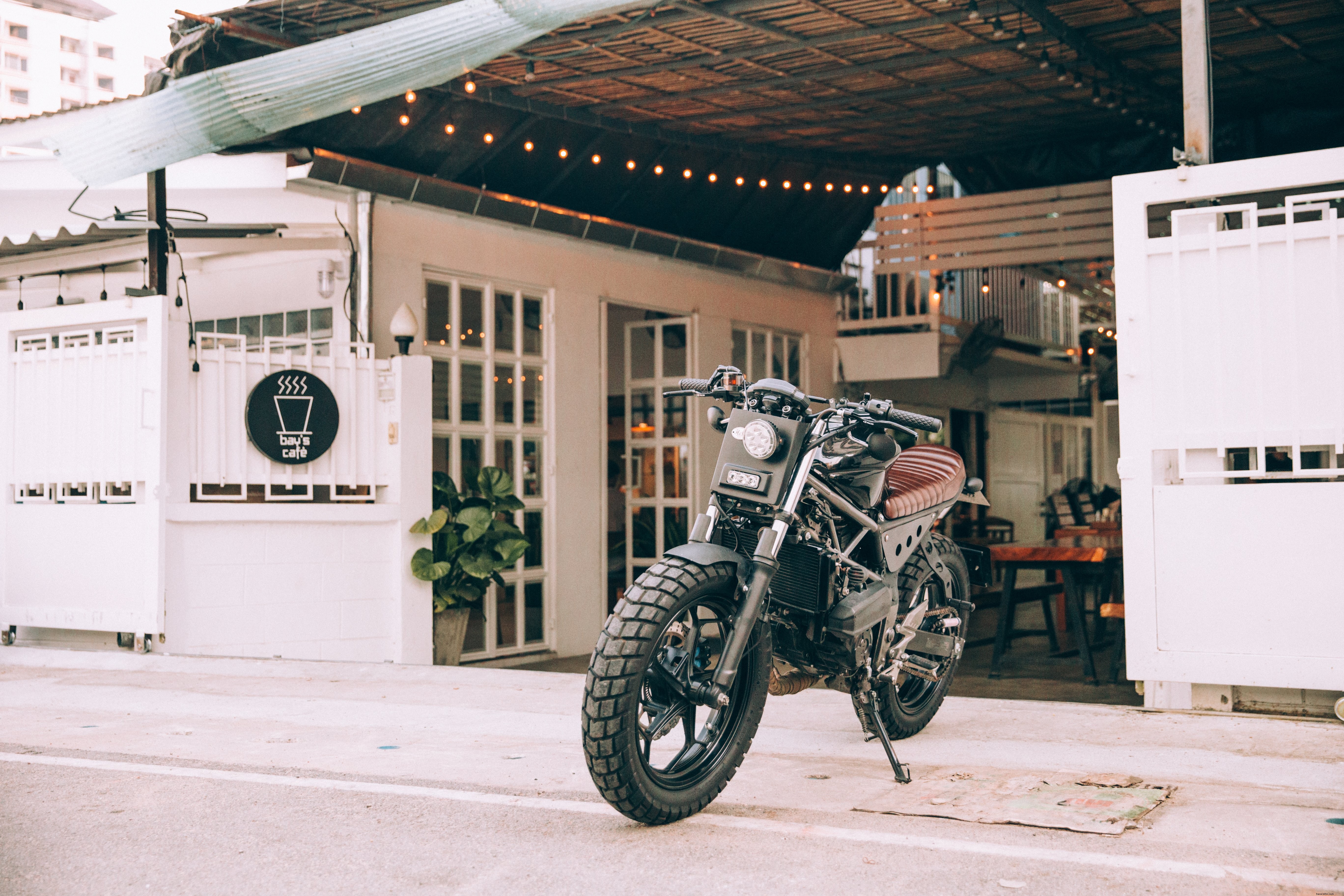 Stunning Motorbike Parked Outside a Charming Cafe – High-Quality Photo