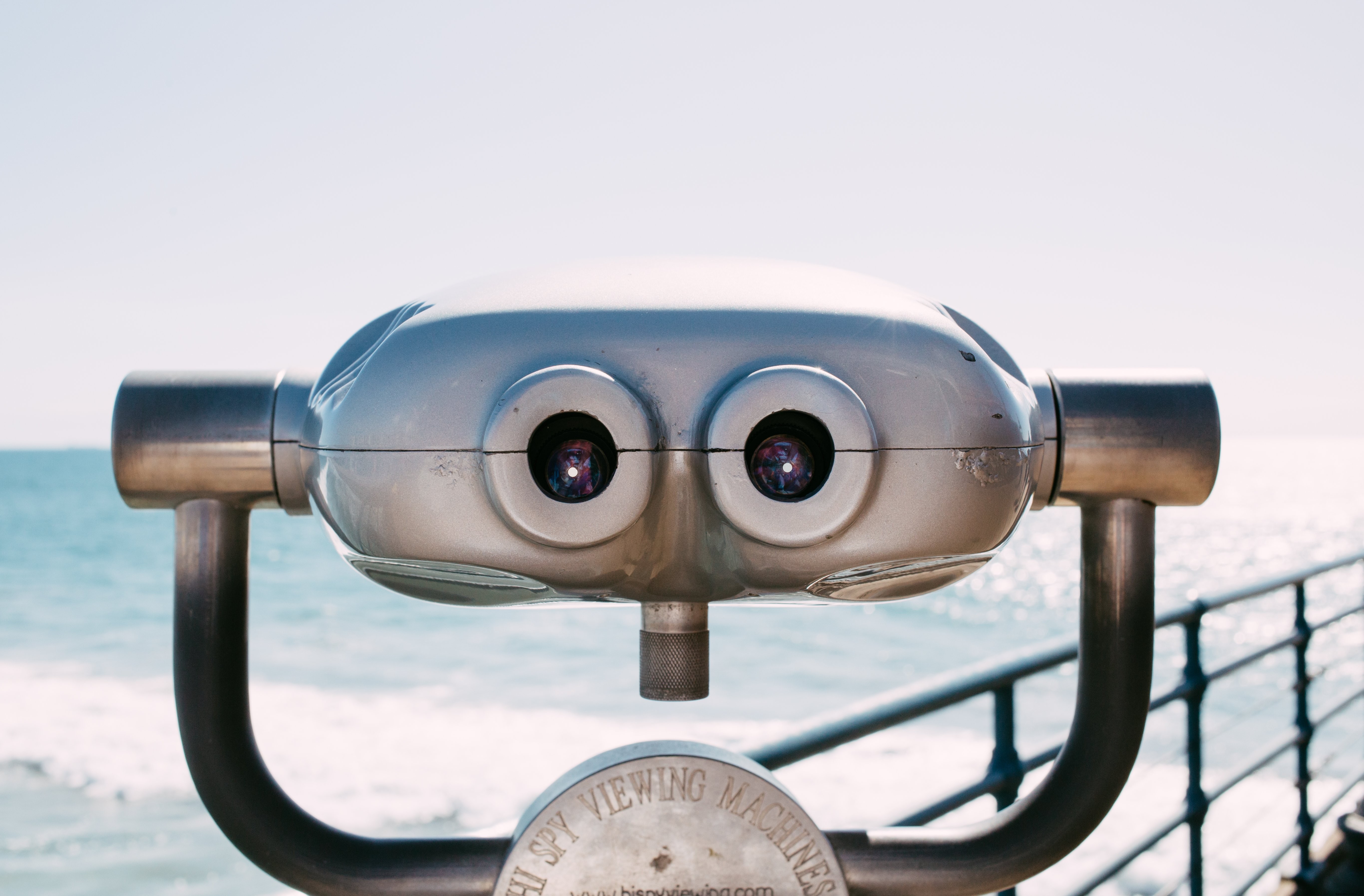 Captivating Photo of a Classic Viewing Machine on a Sunny Boardwalk
