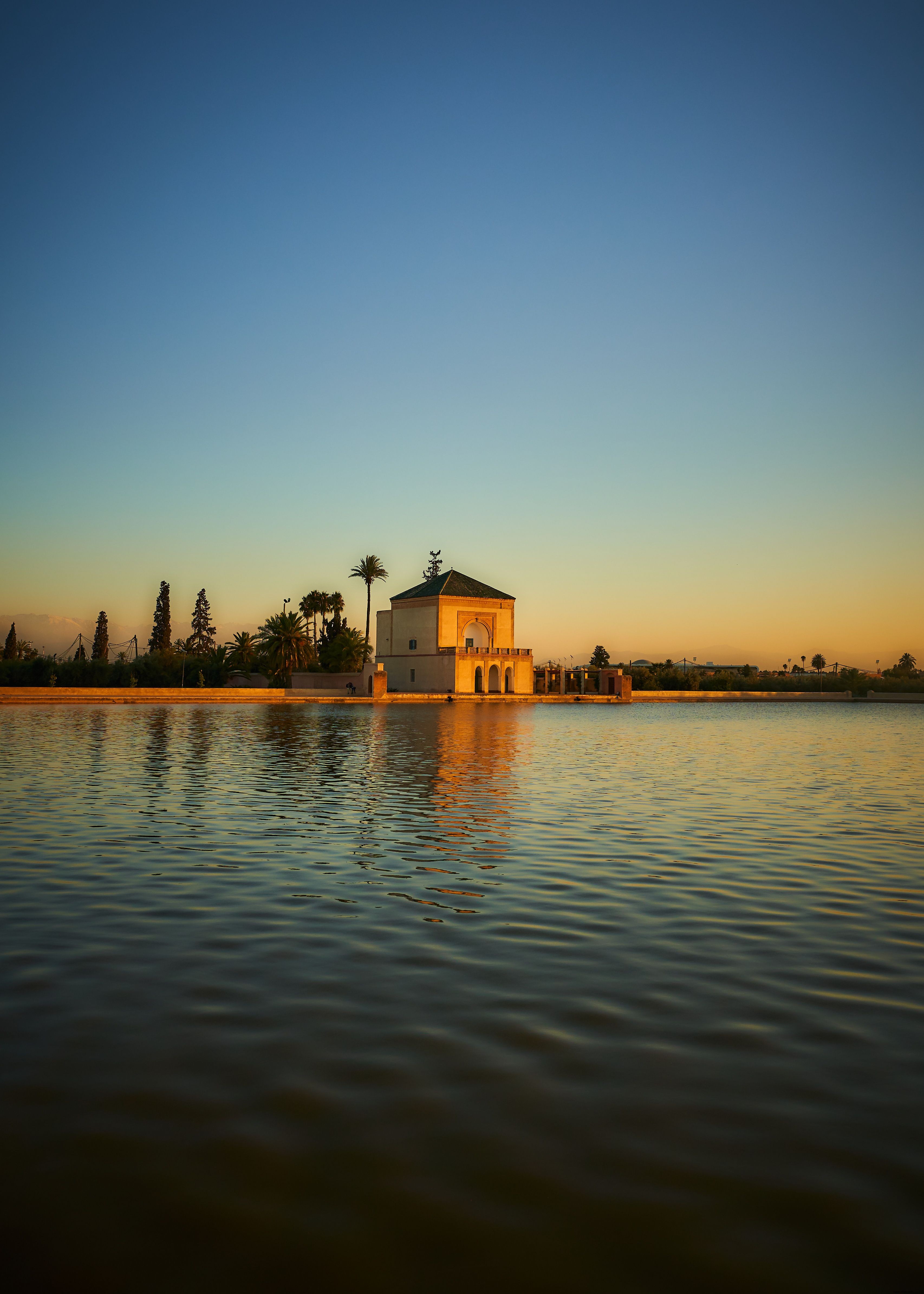 Stunning Wide-Angle View of Majestic Building Over Serene Waters