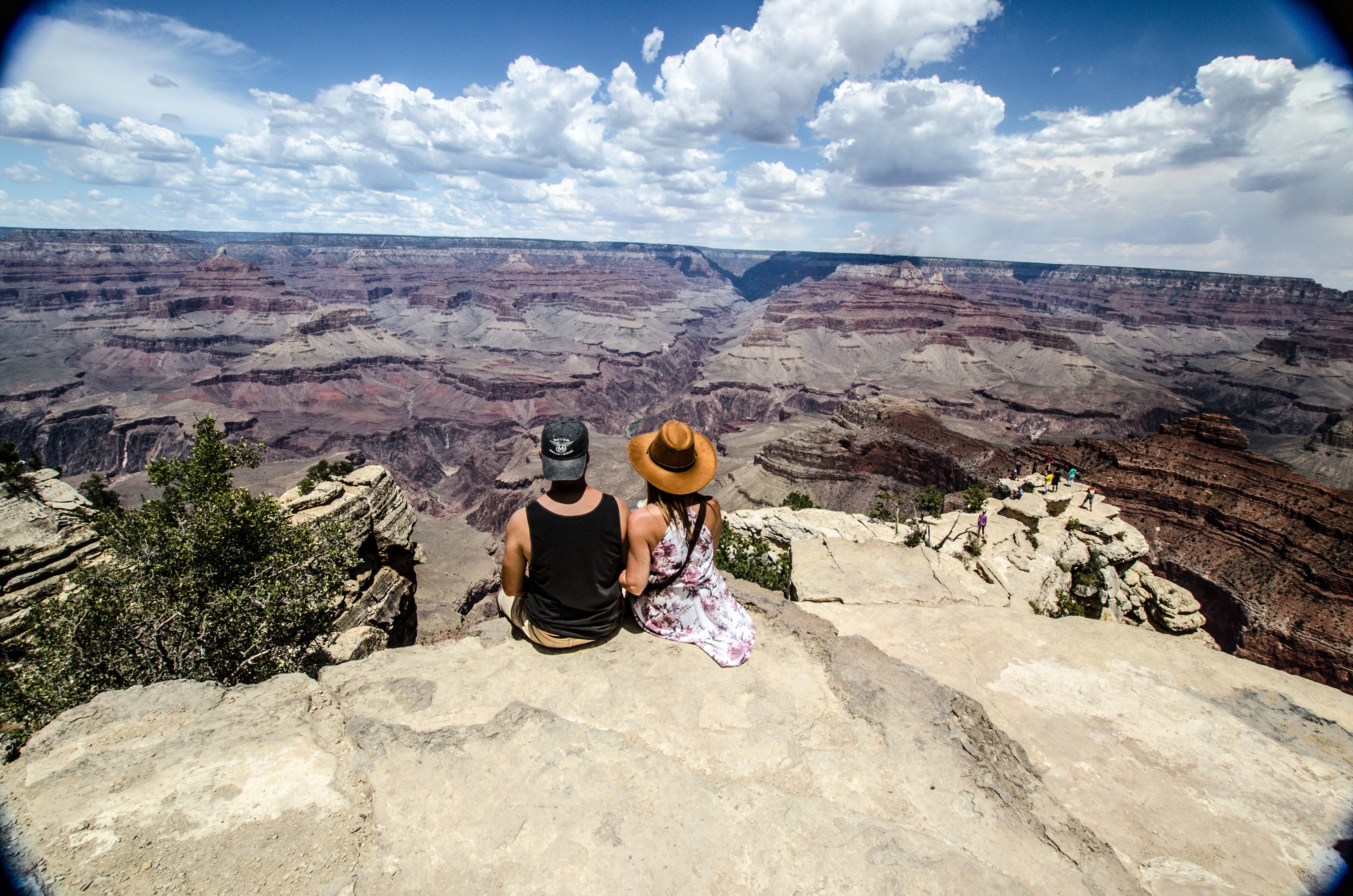 Young Couple Overlooking Stunning Canyon Vista – Breathtaking Scenic Photo