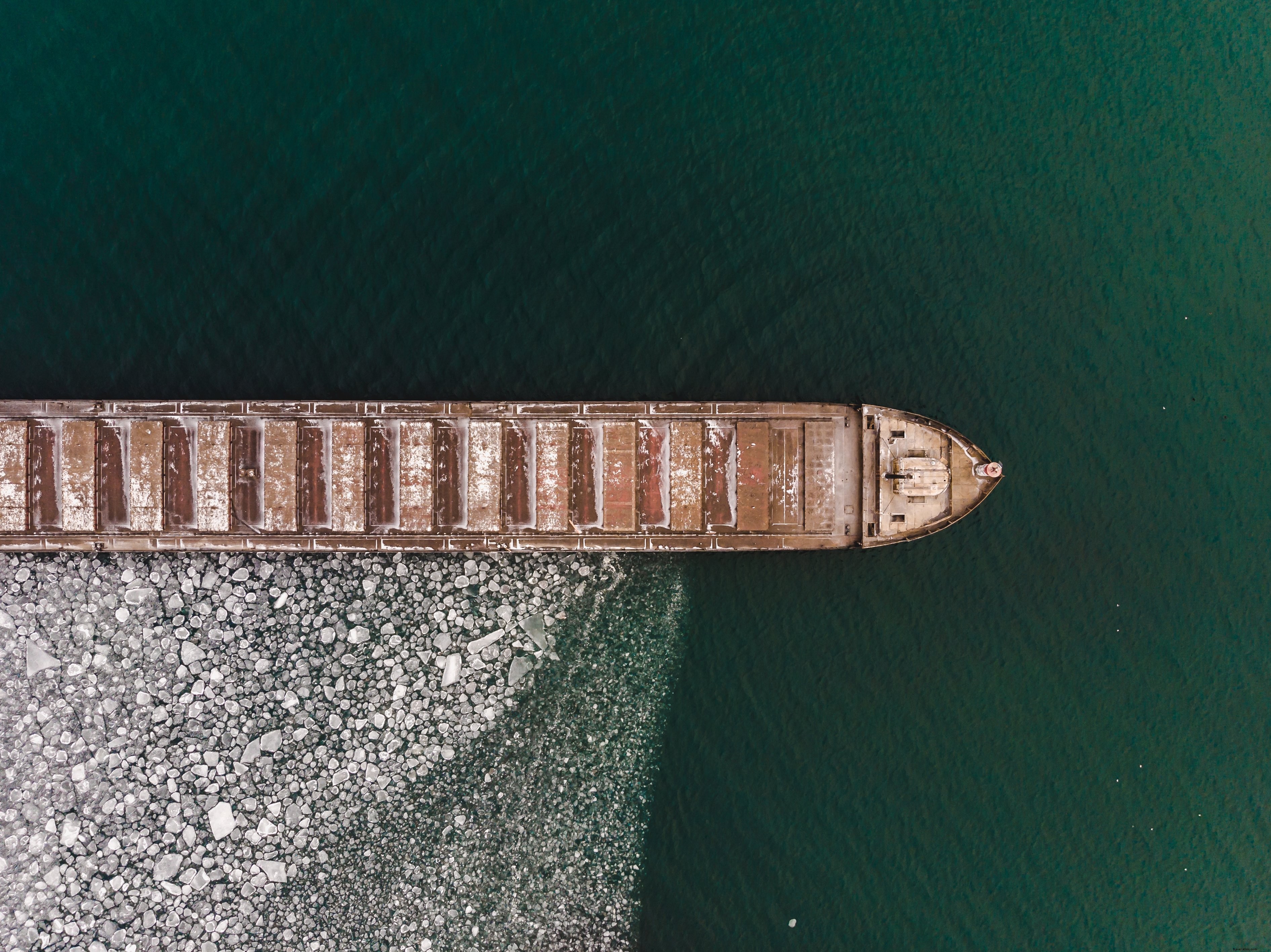 Stunning Aerial View: Boat Surrounded by Ice Floes – Captivating Photo
