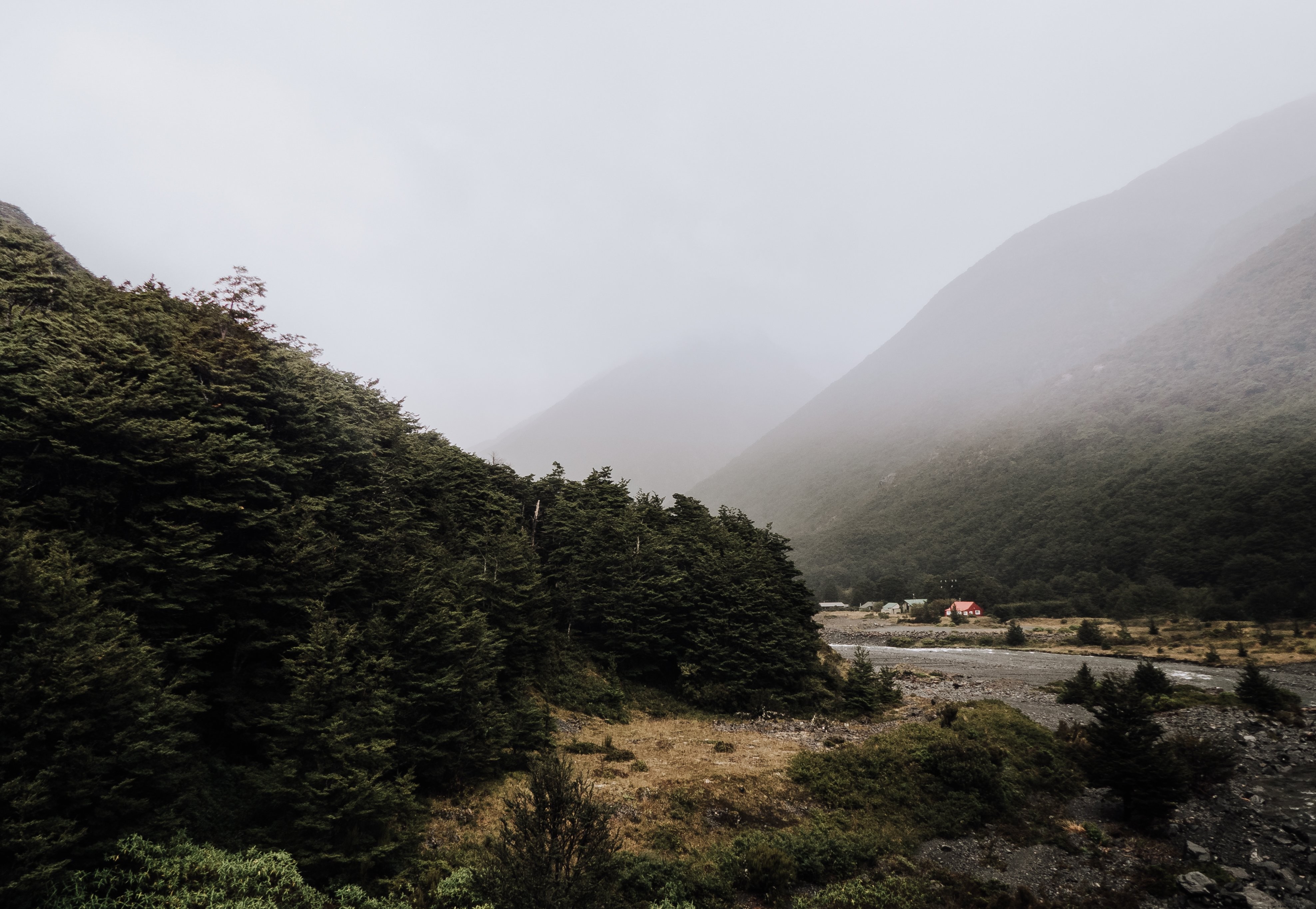 Breathtaking Misty Mountain Valley with Cozy Woodland Huts – Stunning Photo