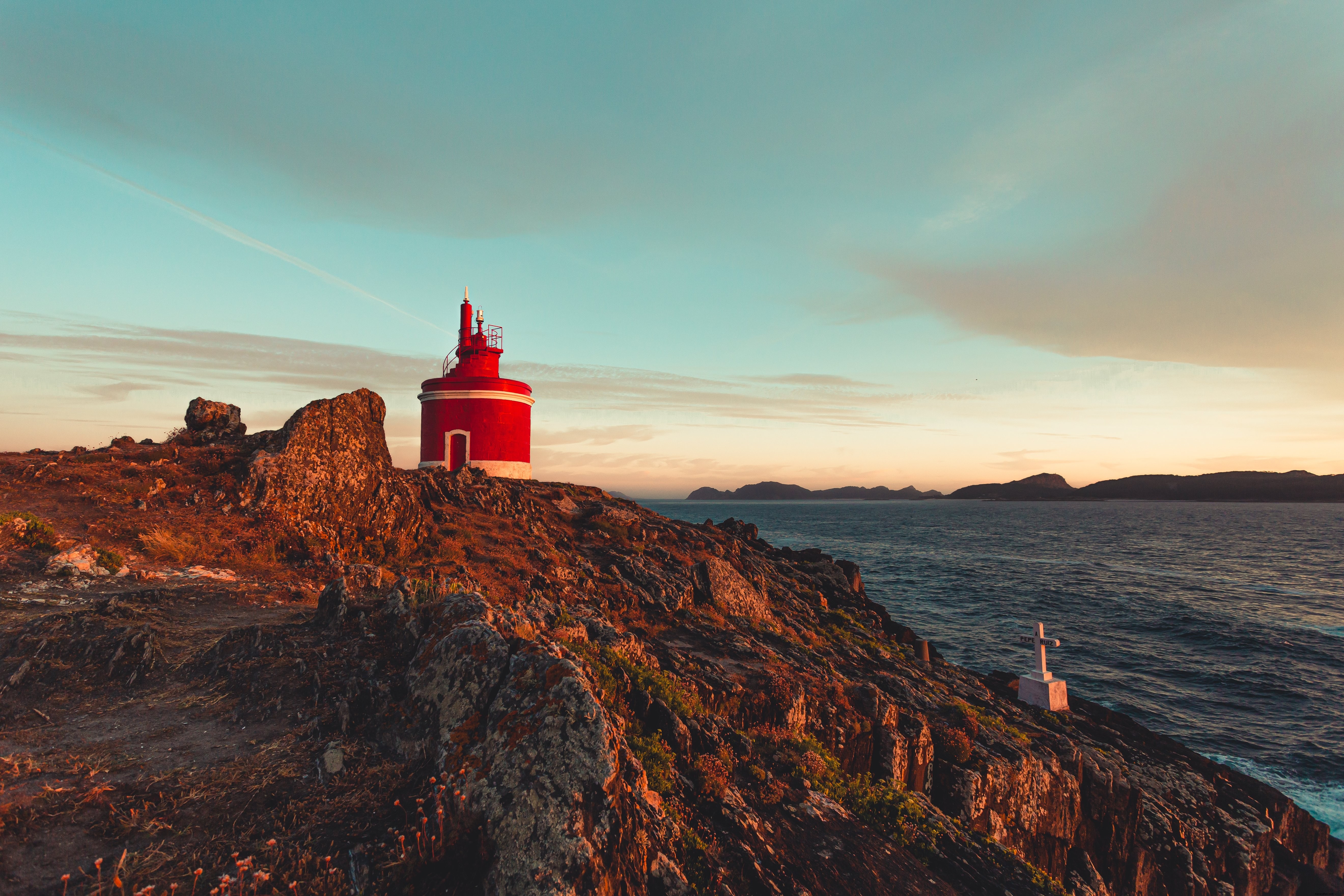 Stunning Photo: Little Red Lighthouse Nestled Among Rugged Rocks
