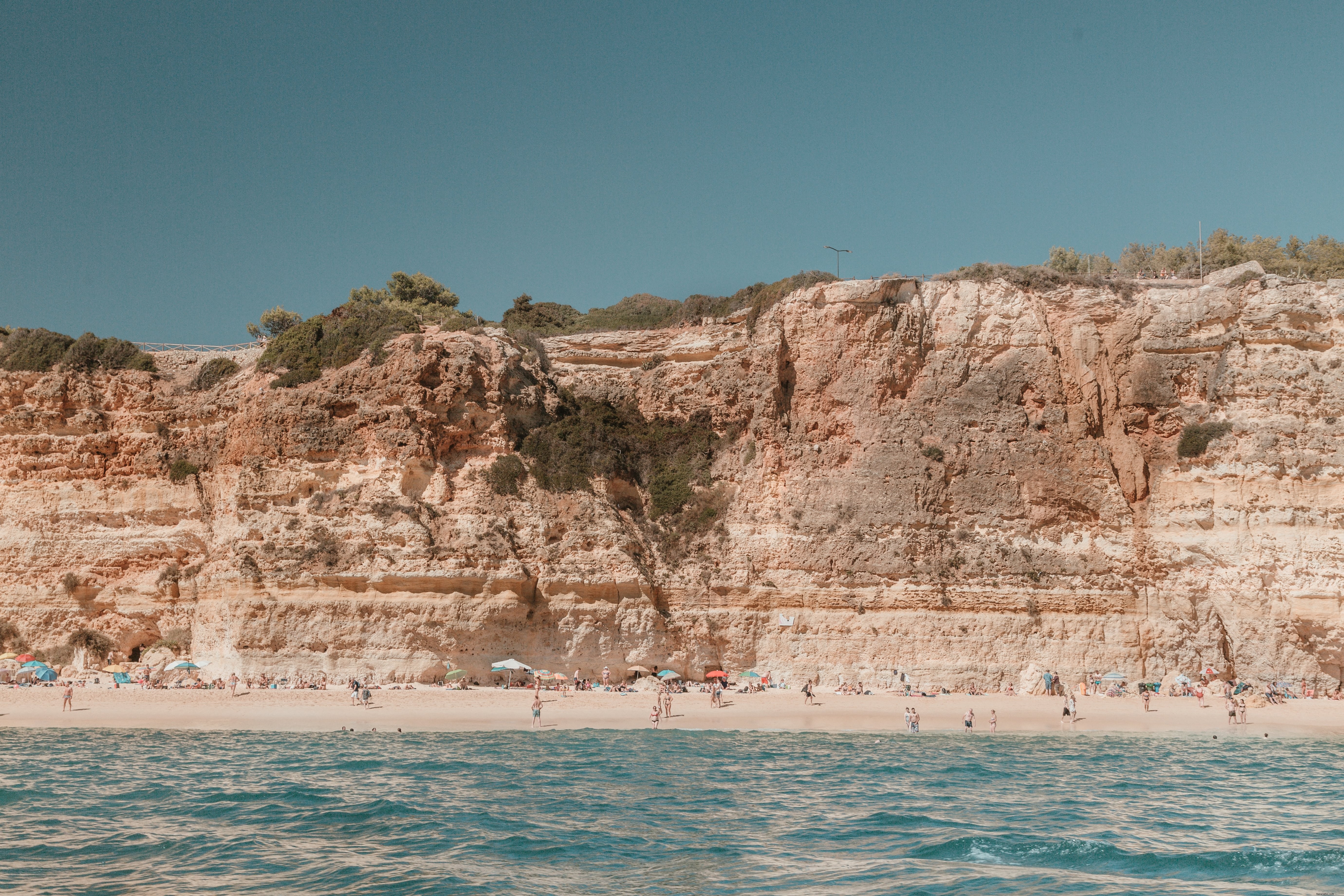 Stunning Long Sandy Beach Beneath Weathered Limestone Cliffs – Breathtaking Photo