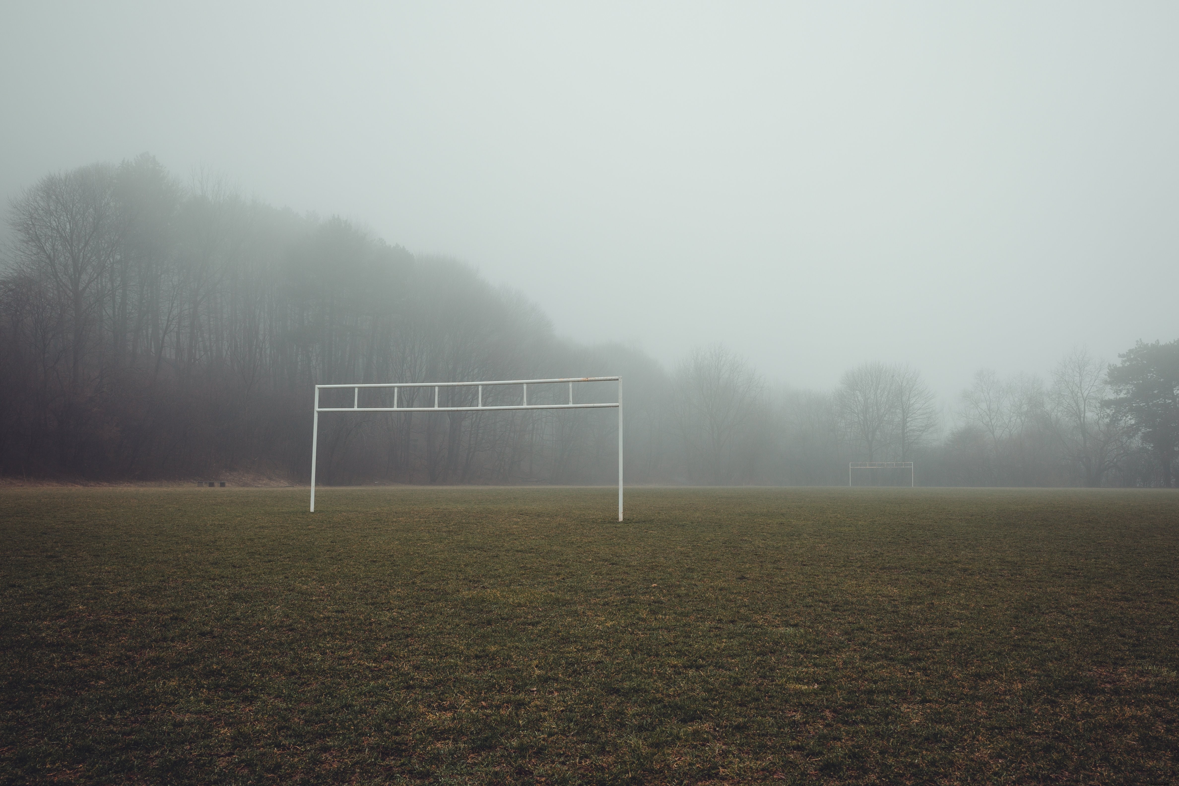 Eerie Foggy Soccer Field: Captivating Atmospheric Photo