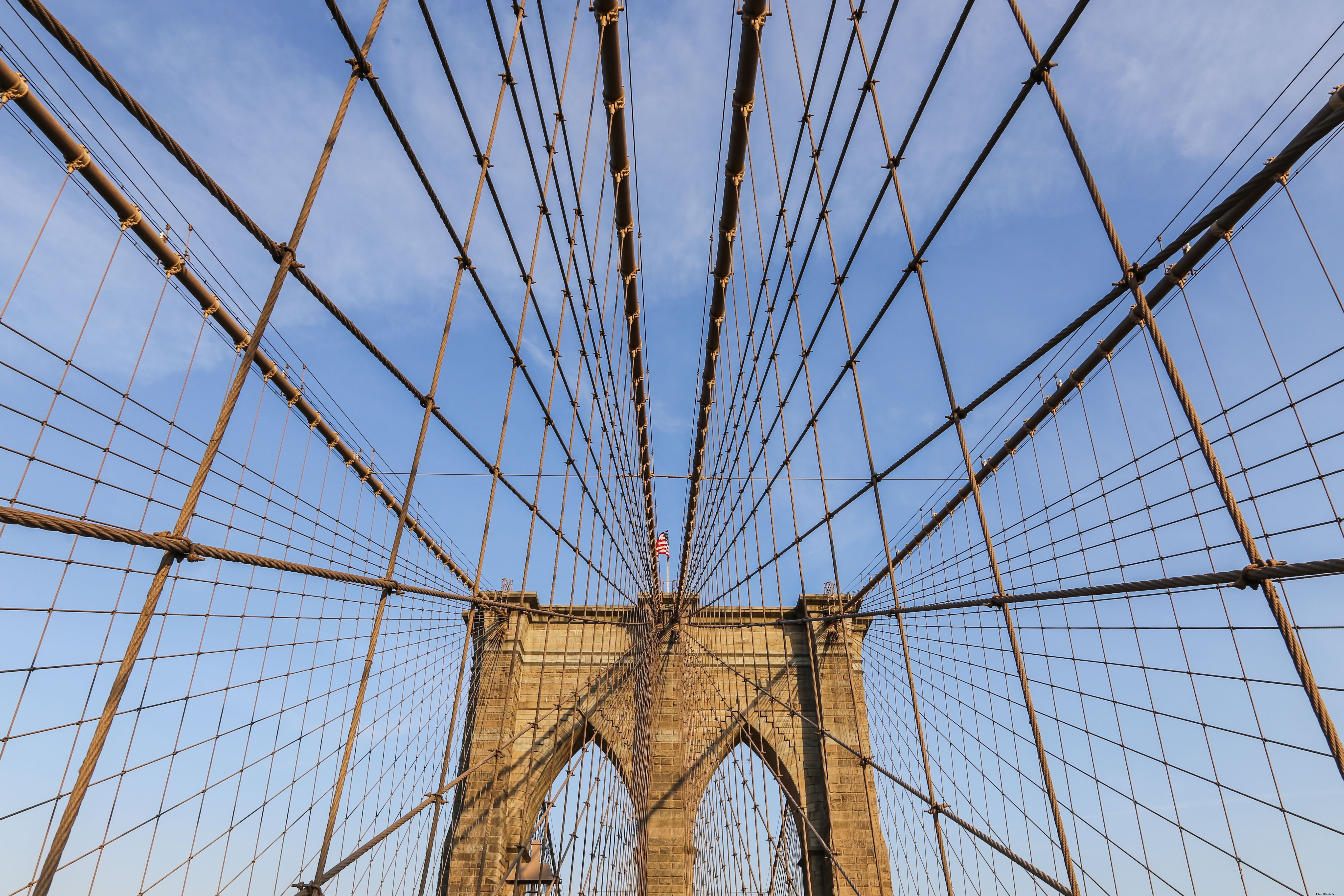 Stunning Bridge Cables Silhouetted Against Vibrant Blue Sky Photo