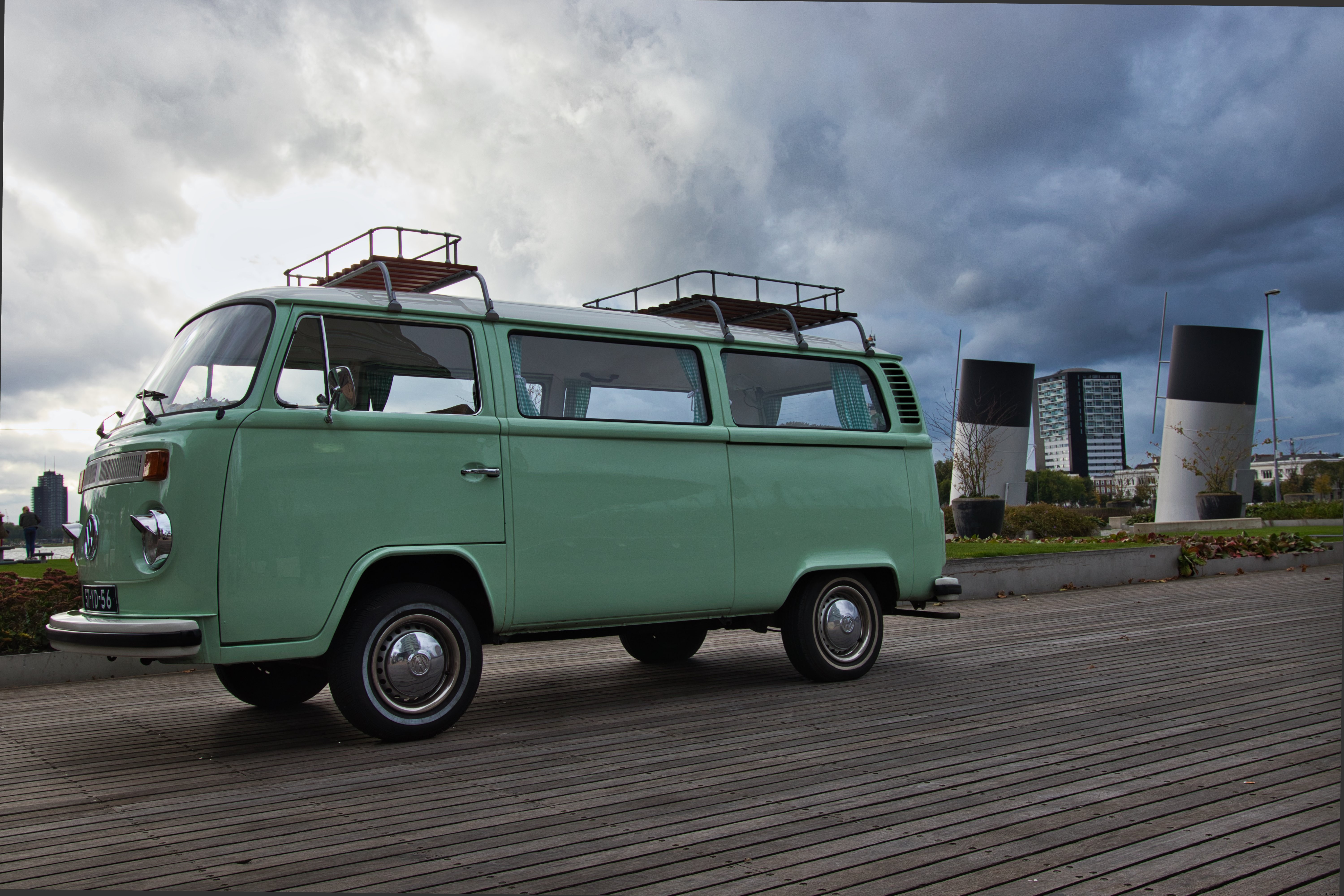 Vintage Teal Camper Van Parked on Rustic Wooden Walkway – Stunning High-Res Photo