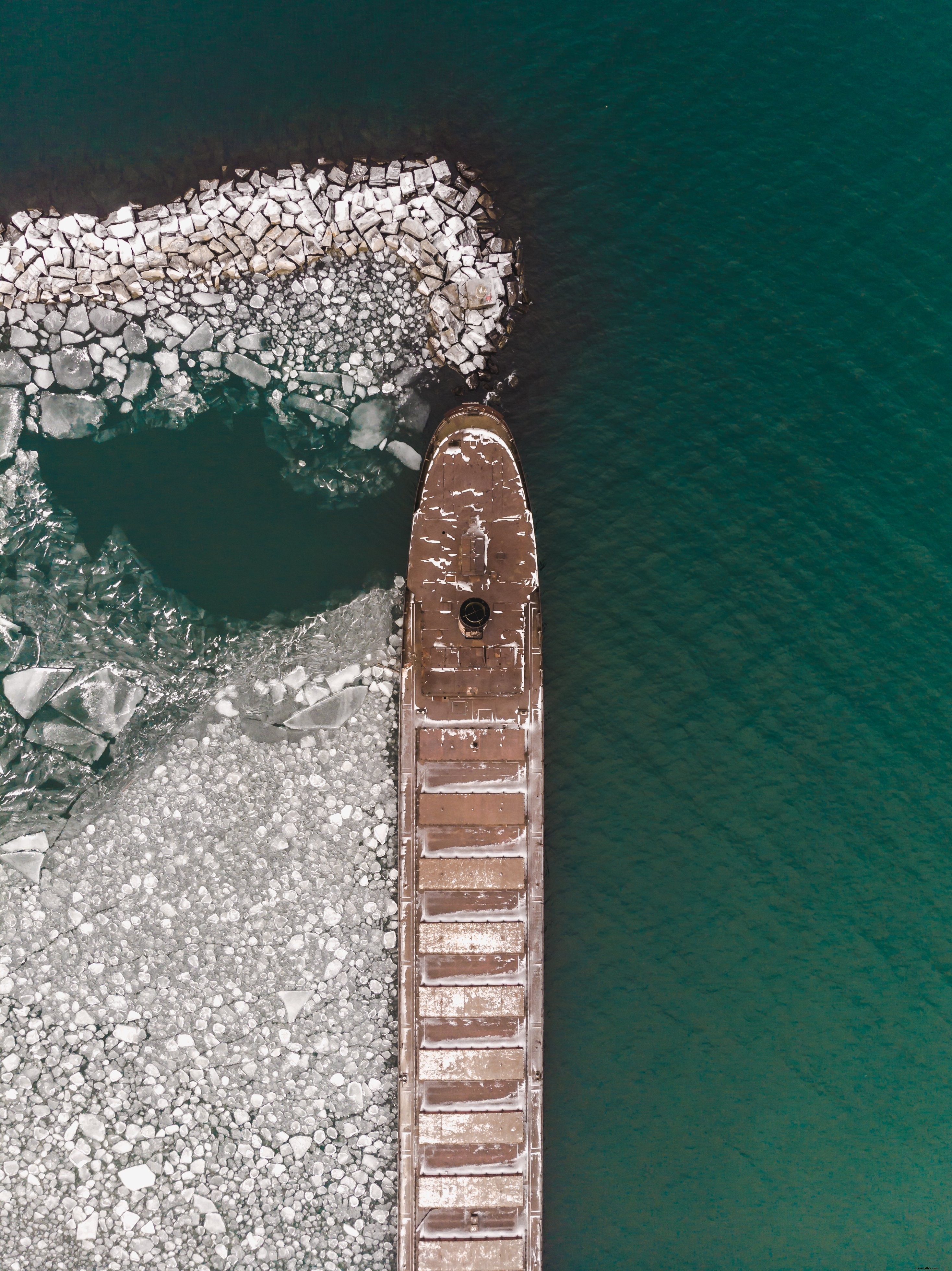 Stunning Aerial View: Ship Surrounded by Vast Ice Fields – Captivating Photo