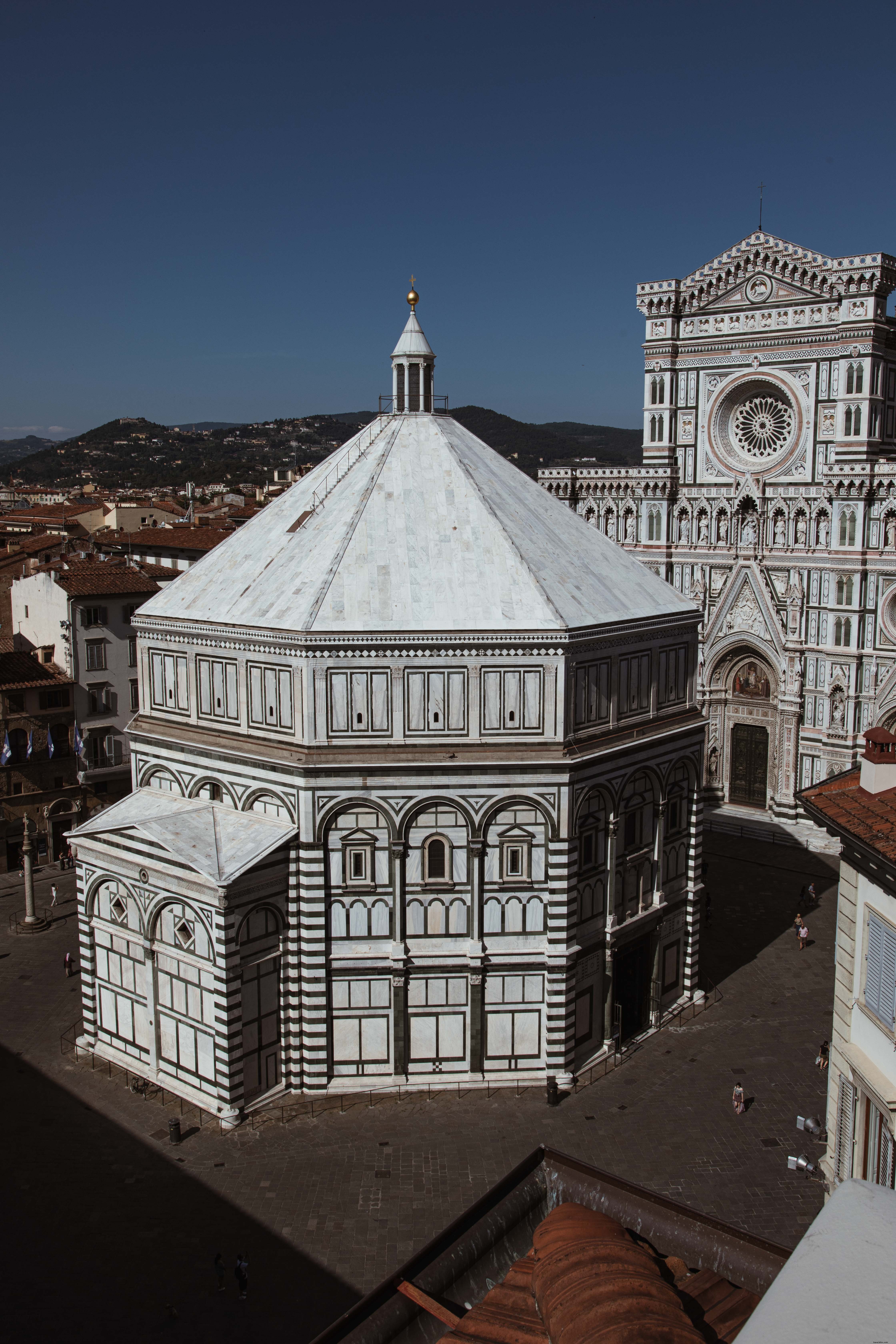 Stunning Angled View of Historic Italian Cathedral Under Vibrant Blue Sky