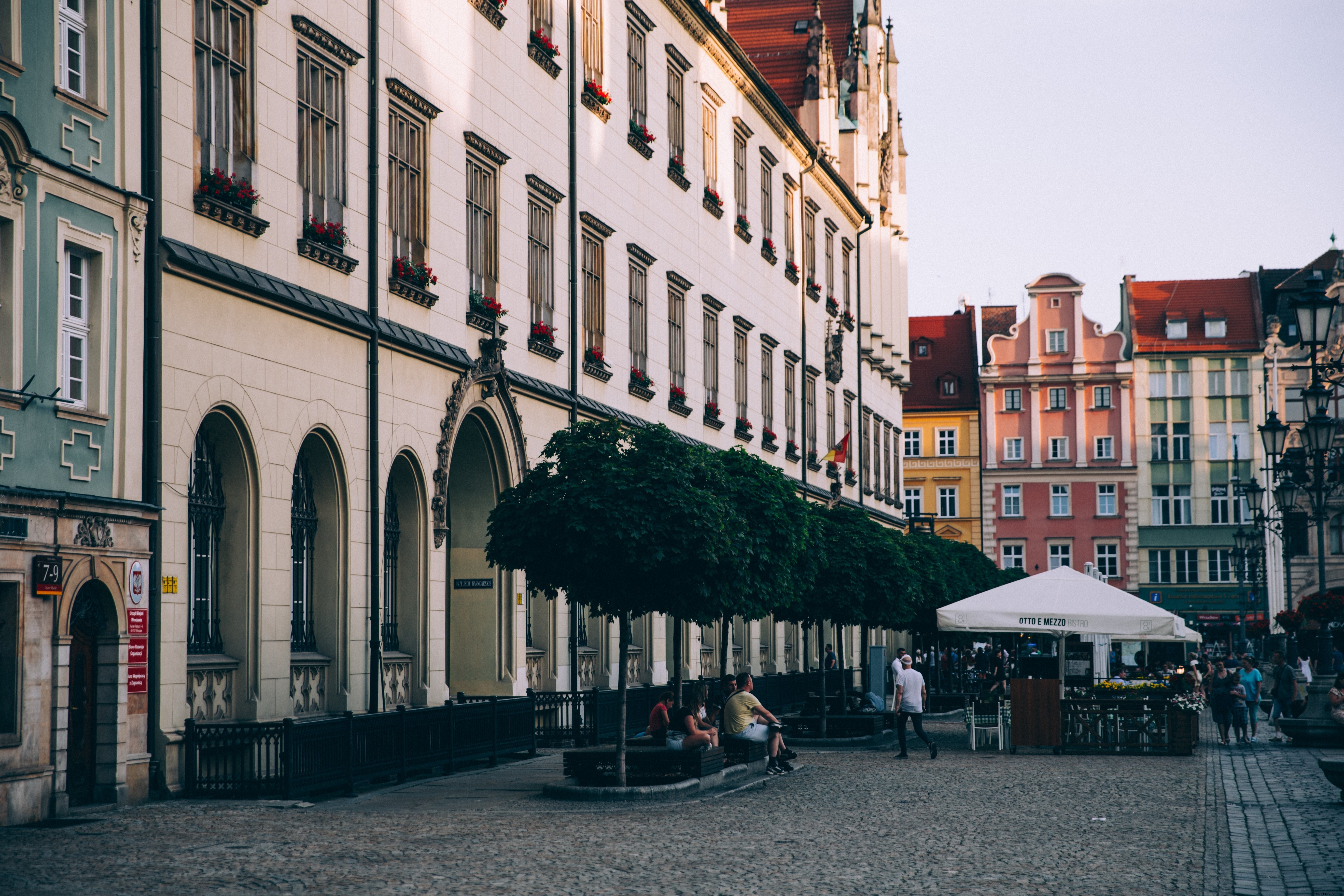 Vibrant Italian Piazza: Colorful Buildings Frame Outdoor Dining Scene