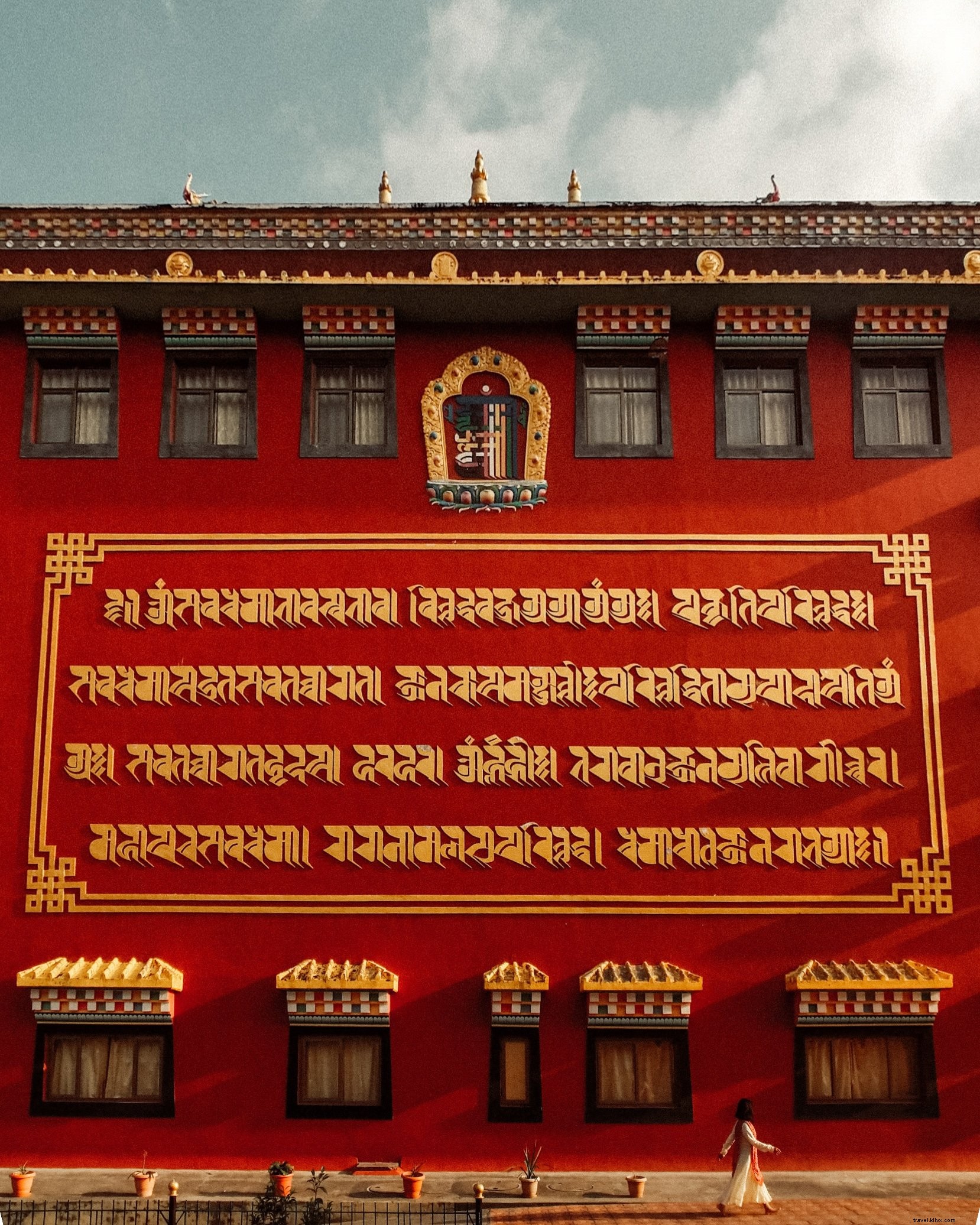 Stunning Photo: Golden Lettering on a Vibrant Red Temple