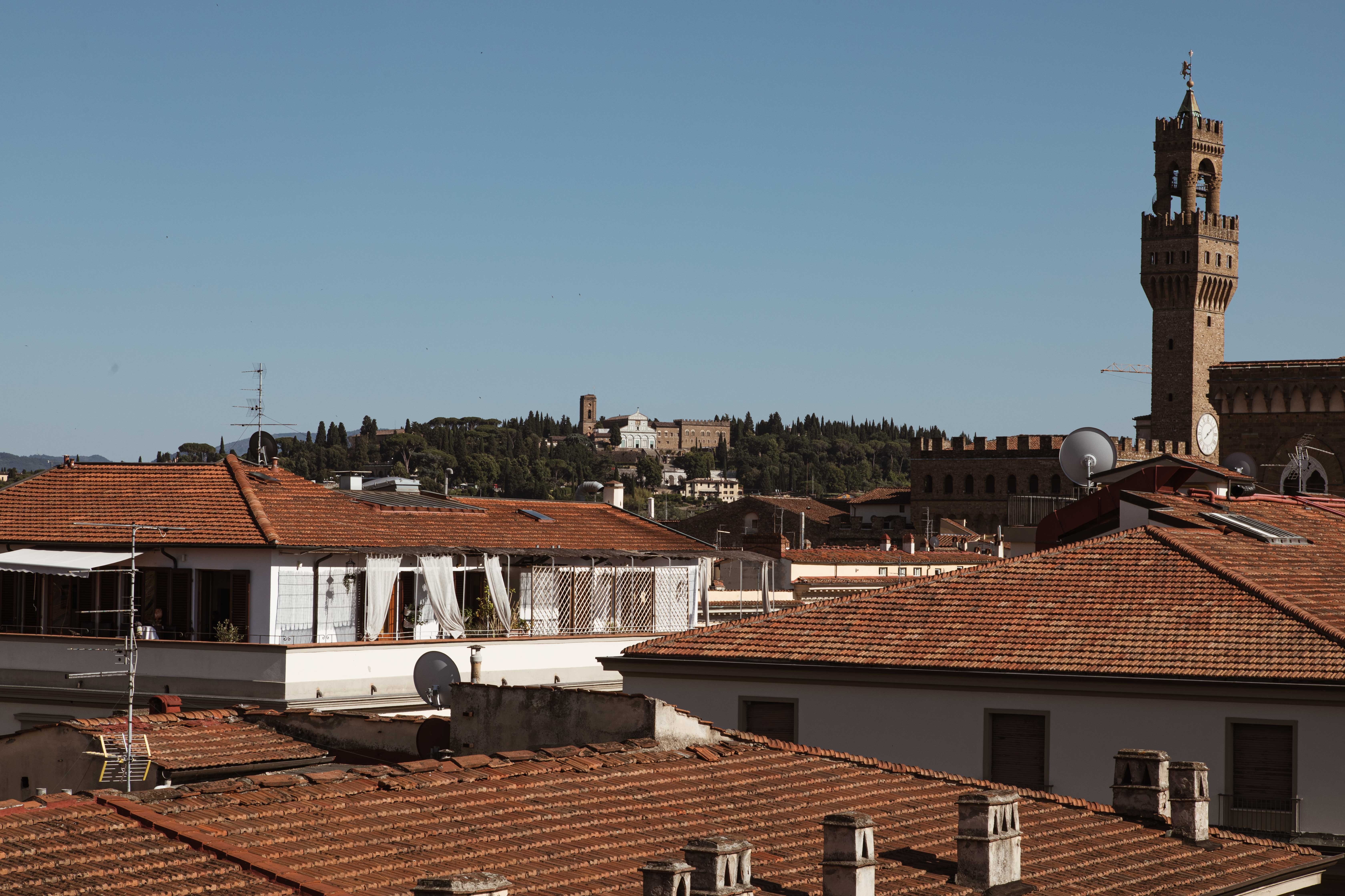 Majestic Church Spire Rising Above Terracotta Rooftops – Stunning Photo