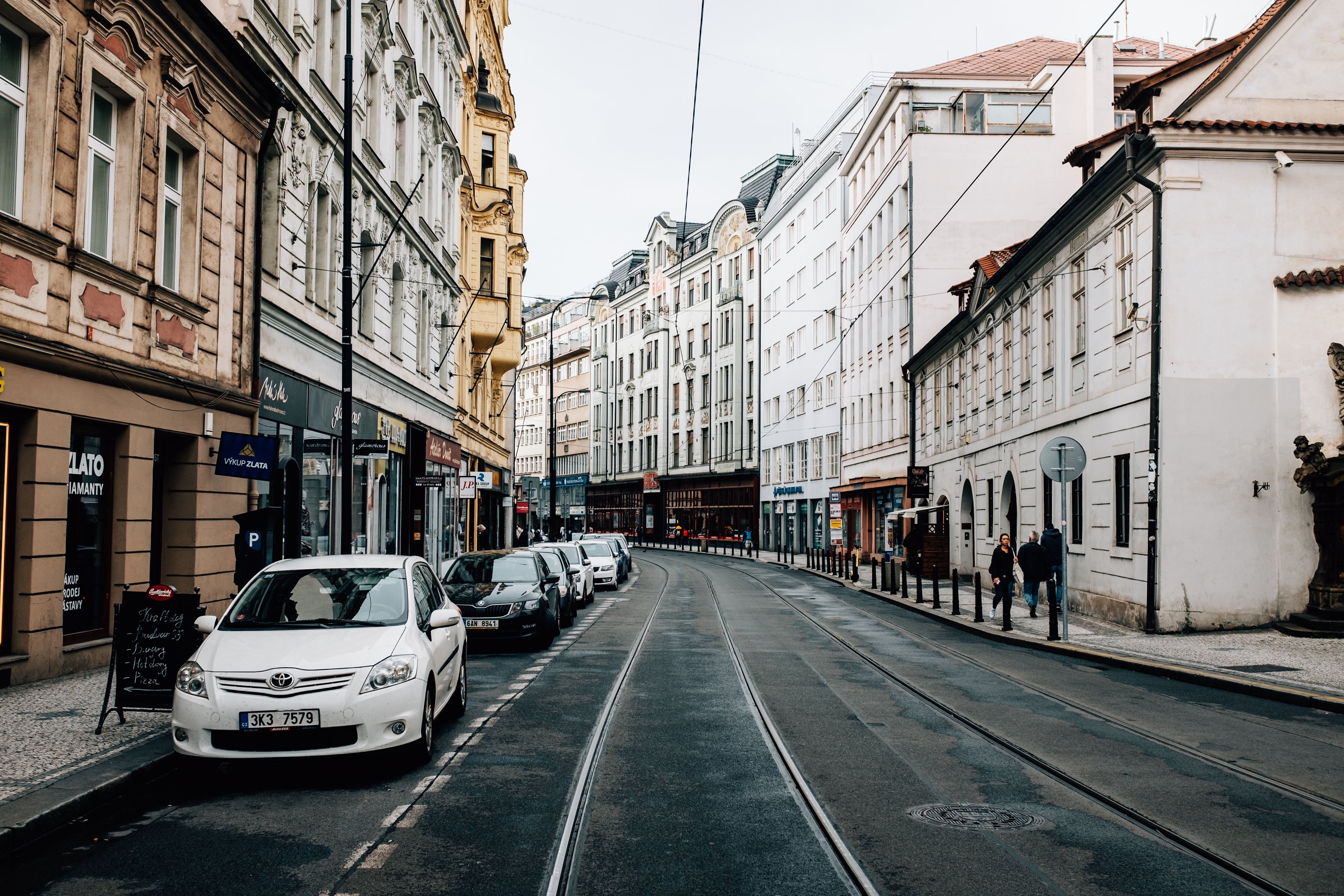 Stunning Photo: Narrow City Street Lined with Tall, Slender Buildings