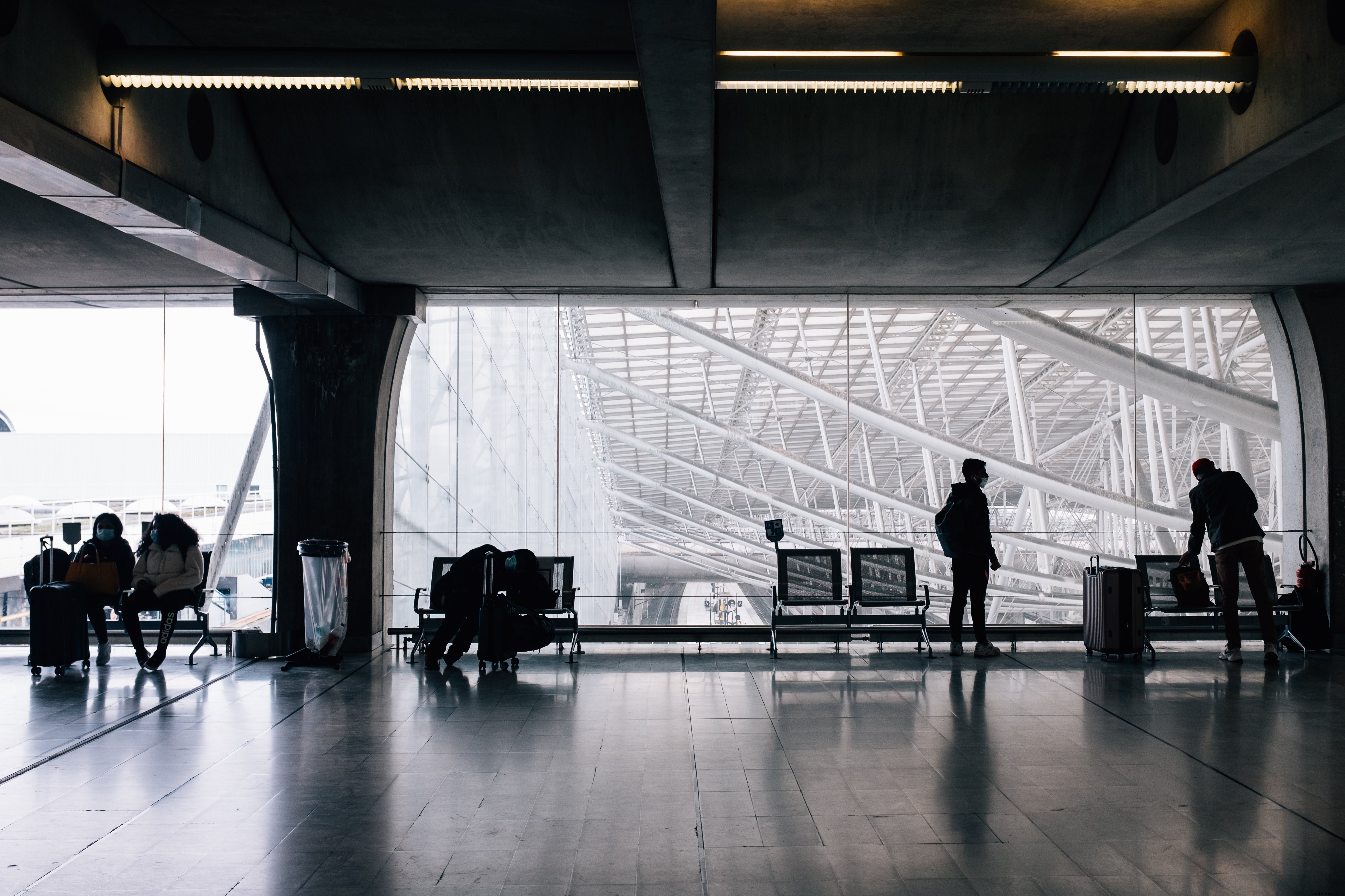 Masked Travelers Waiting with Luggage at Airport – Stock Photo