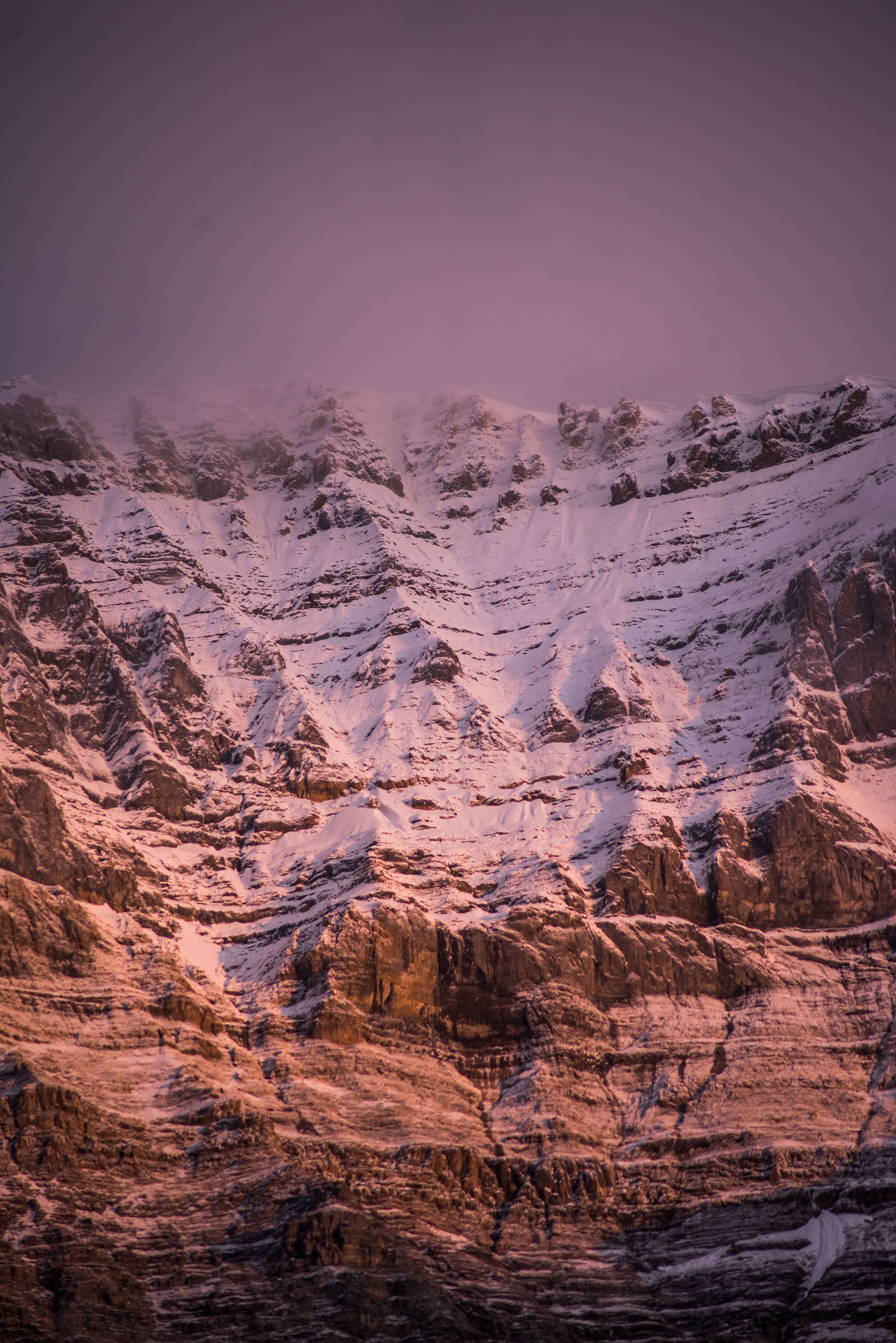 Breathtaking Pink Glow Over Snow-Capped Mountains – Stunning Landscape Photo