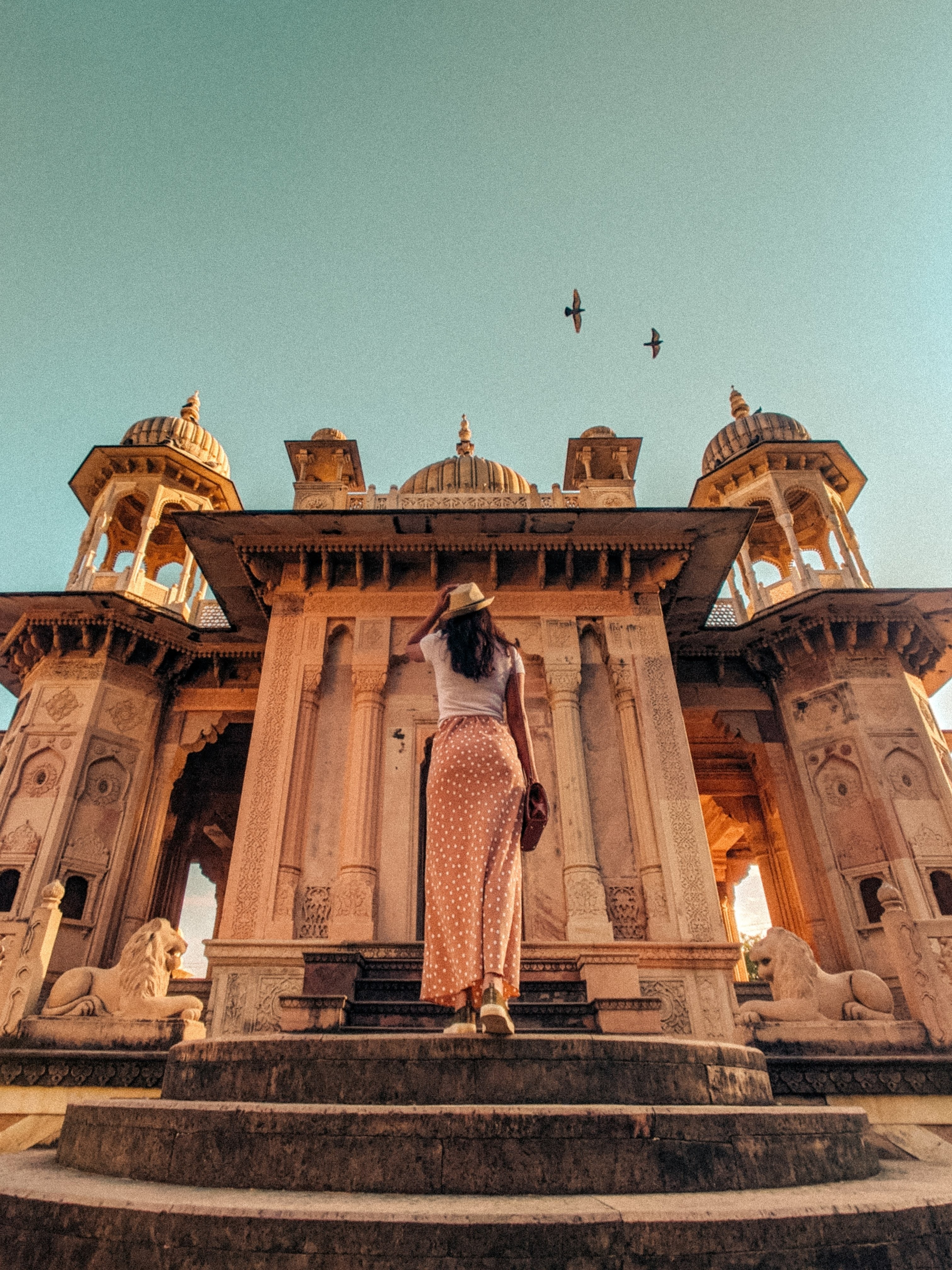Stunning Photo: Woman Captivated by Majestic Eastern Architecture