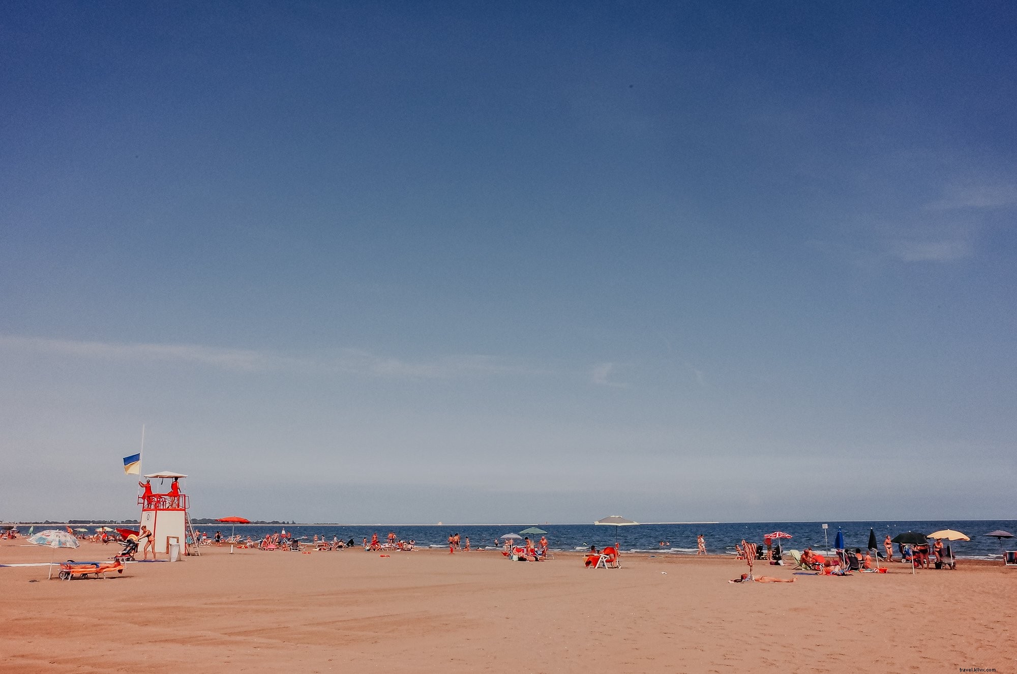 Stunning Beach Photo: People Enjoying a Crystal-Clear Sunny Day