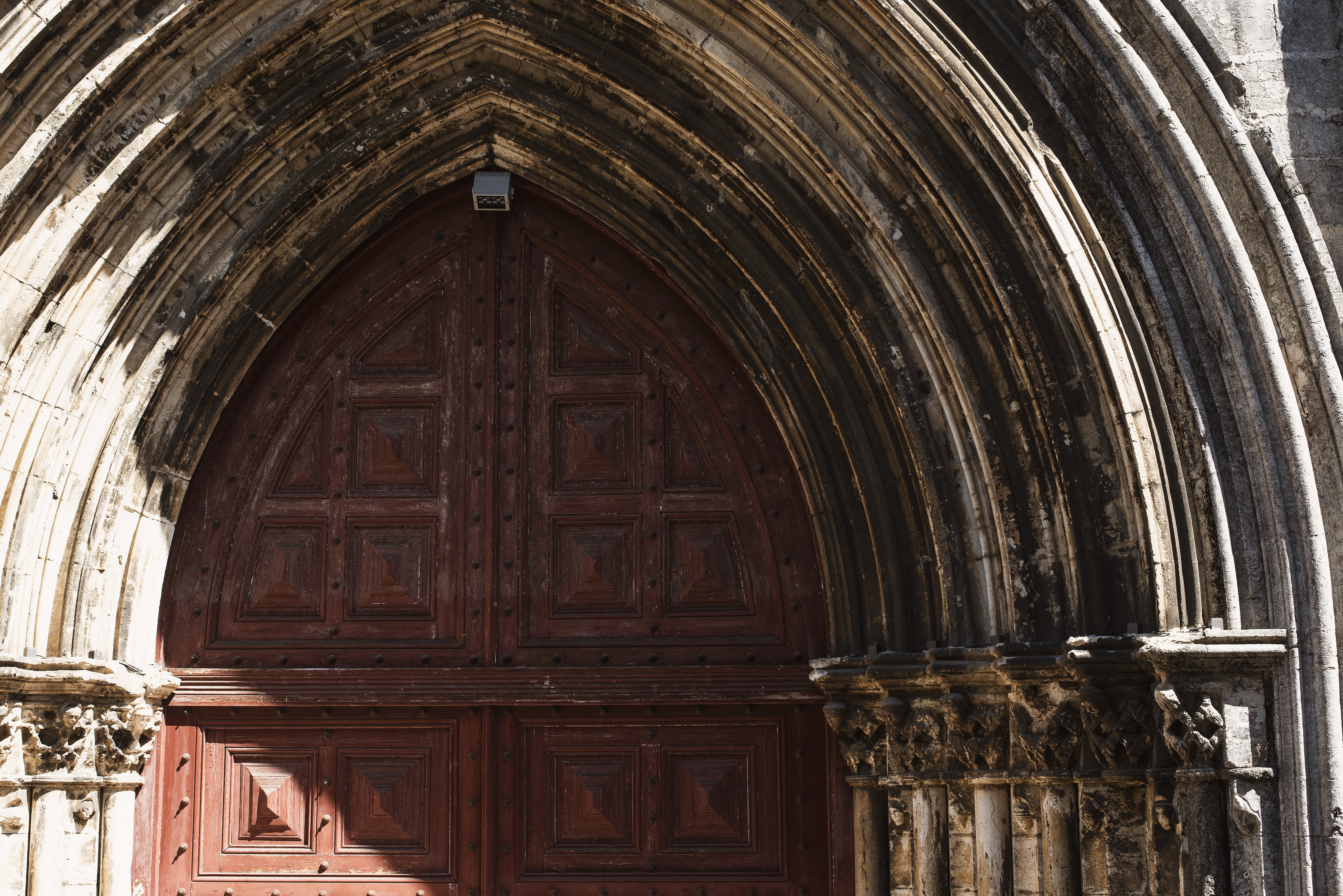 Captivating Shadows in a Baroque Archway: Stunning Architectural Photography