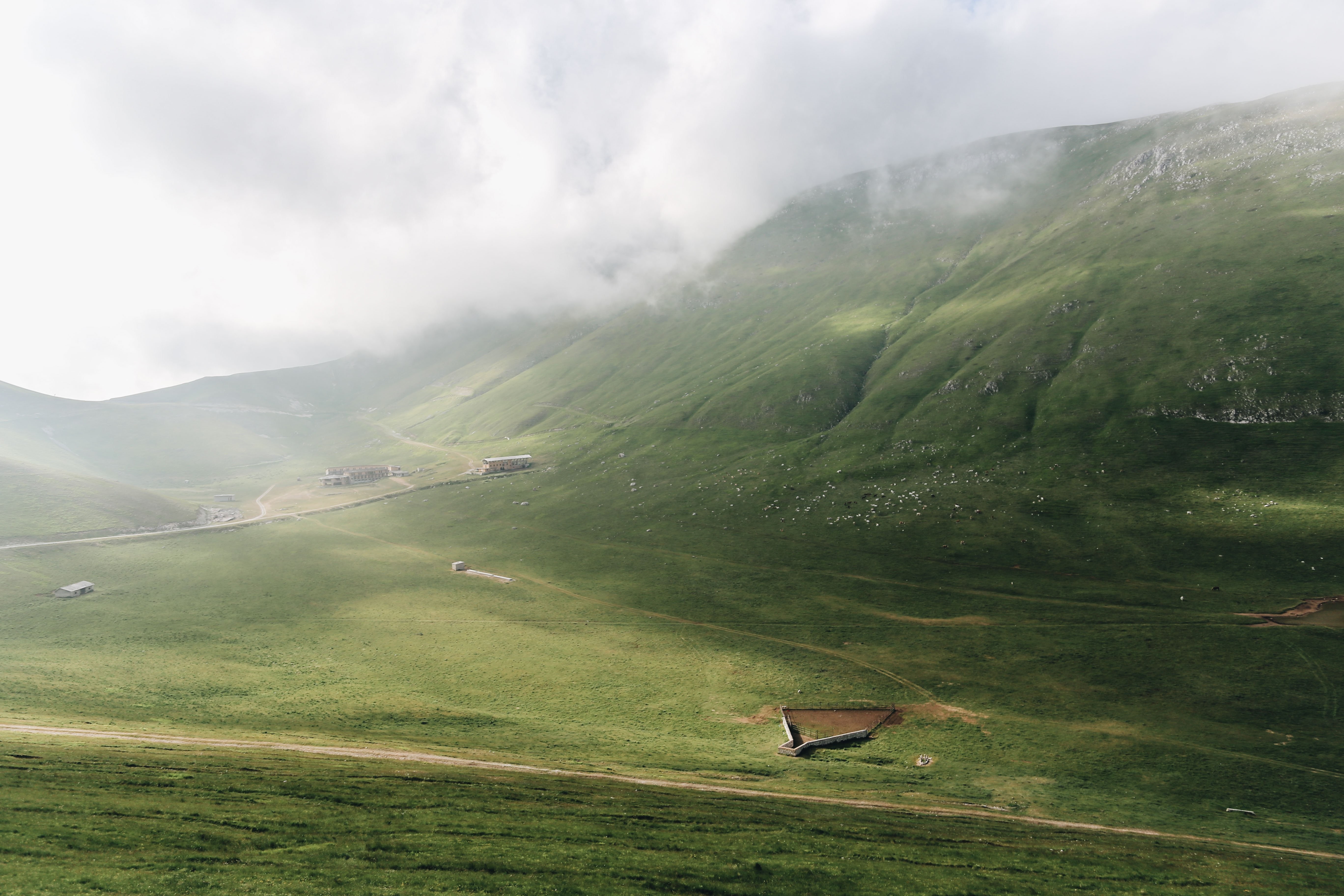 Stunning Green Hills Reaching for the Sky: Breathtaking Landscape Photo