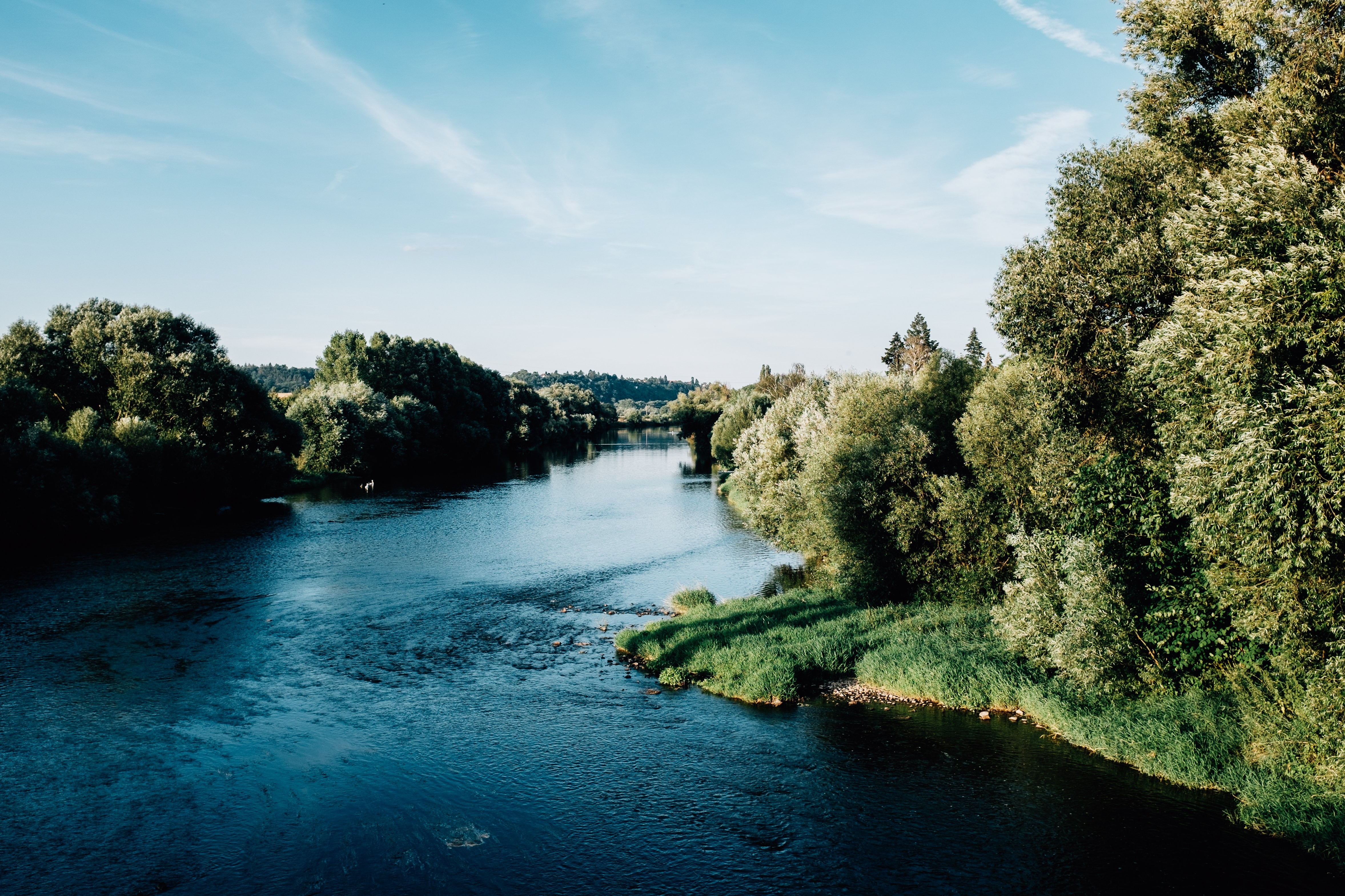Stunning Summer Landscape: Crystal Blue Waters and Lush Green Trees
