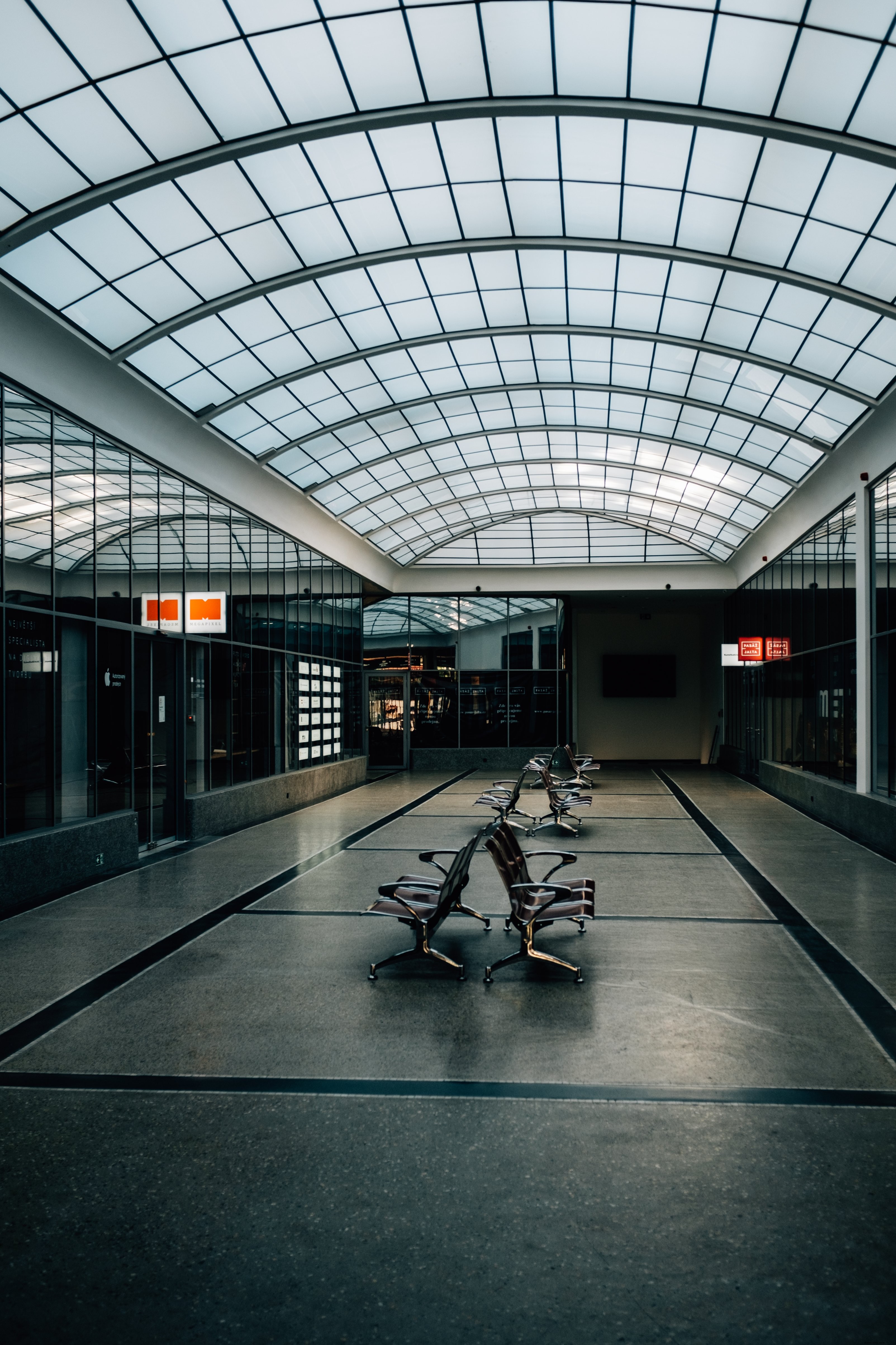 Evocative Photo: Solitary Vacant Chair in a Deserted Train Station
