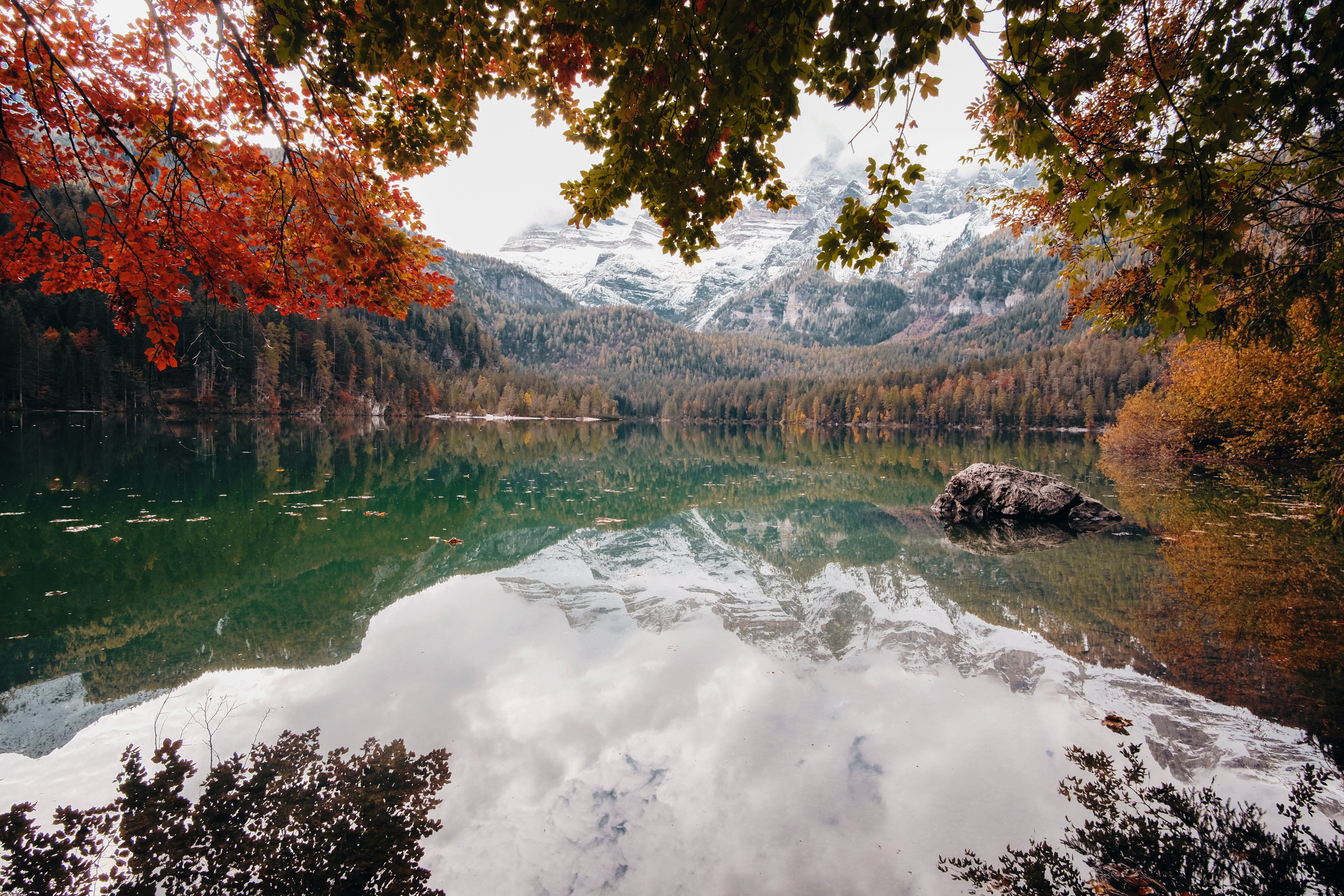 Breathtaking Fall Vista: Serene Lake and Snow-Capped Mountains Photo