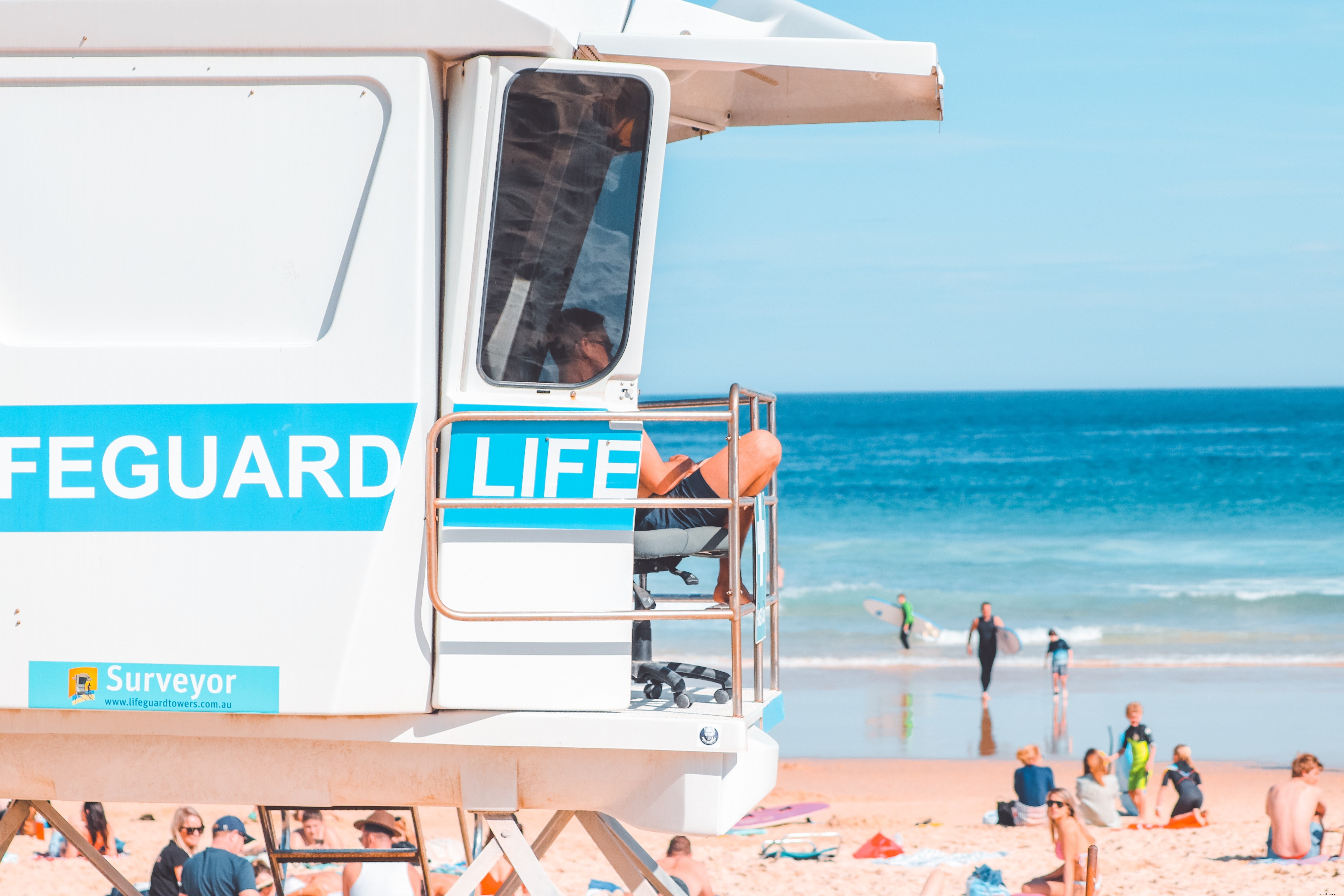 Lifeguard Perched on Elevated White Stand – Stunning Beach Safety Photo