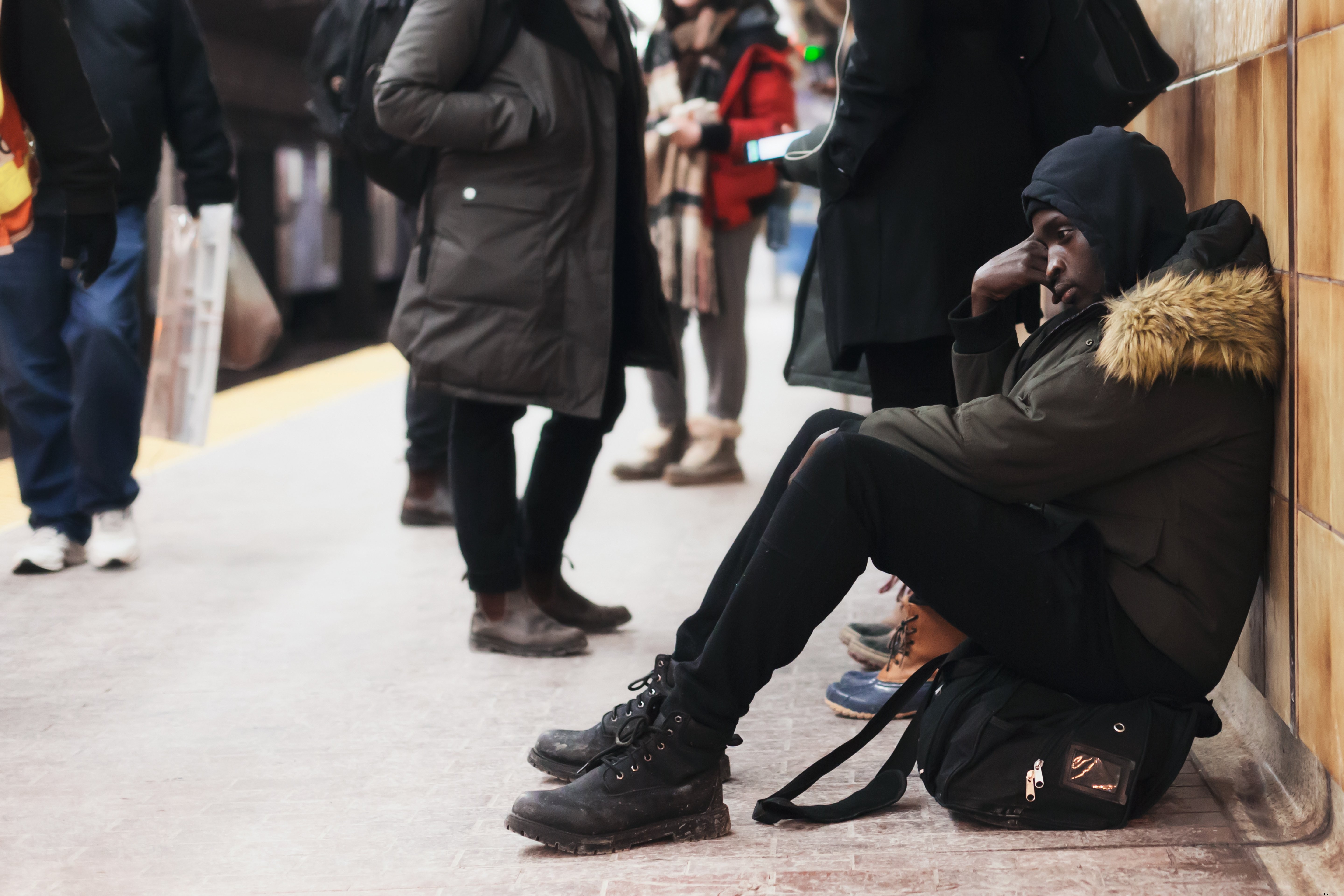 Somber Commuter Man Sitting in Quiet Reflection – Stunning Stock Photo