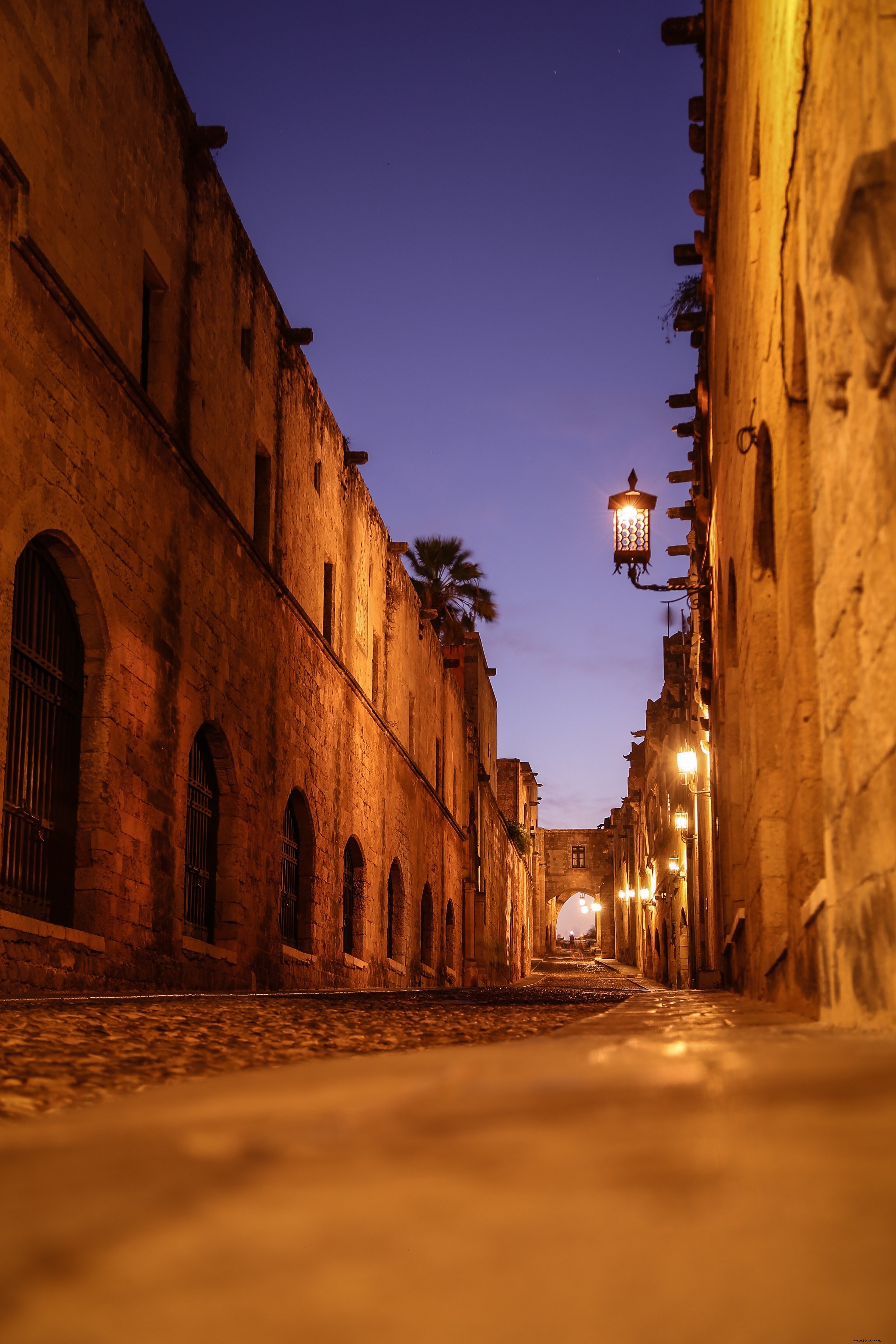 Captivating Nighttime Photo: Illuminated Stone Alleyway
