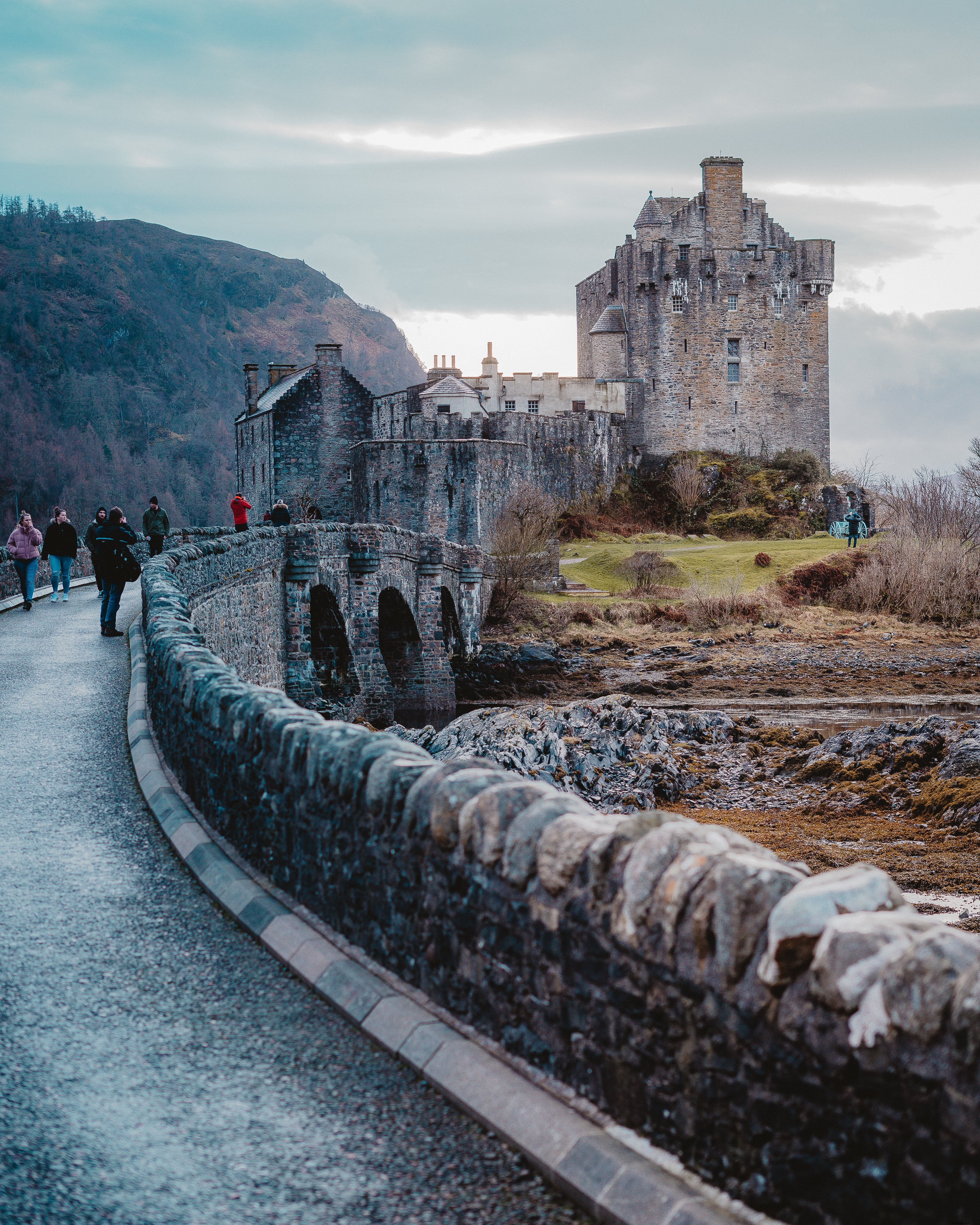Majestic Stone Castle Perched on a Hill Under Dramatic Clouds