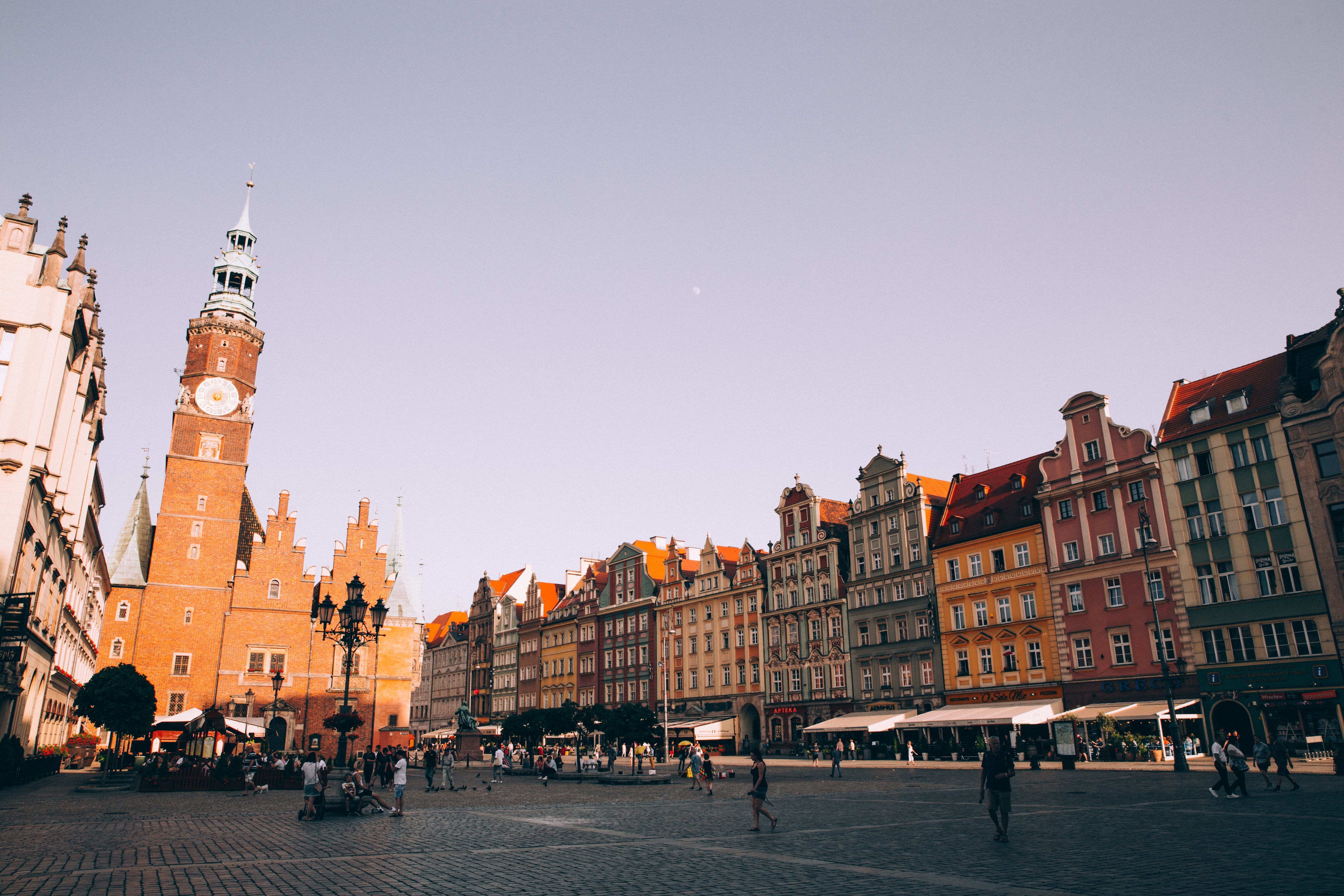 Stunning Sunset Over Red Brick Tower in Cobbled Piazza – Photographic Masterpiece