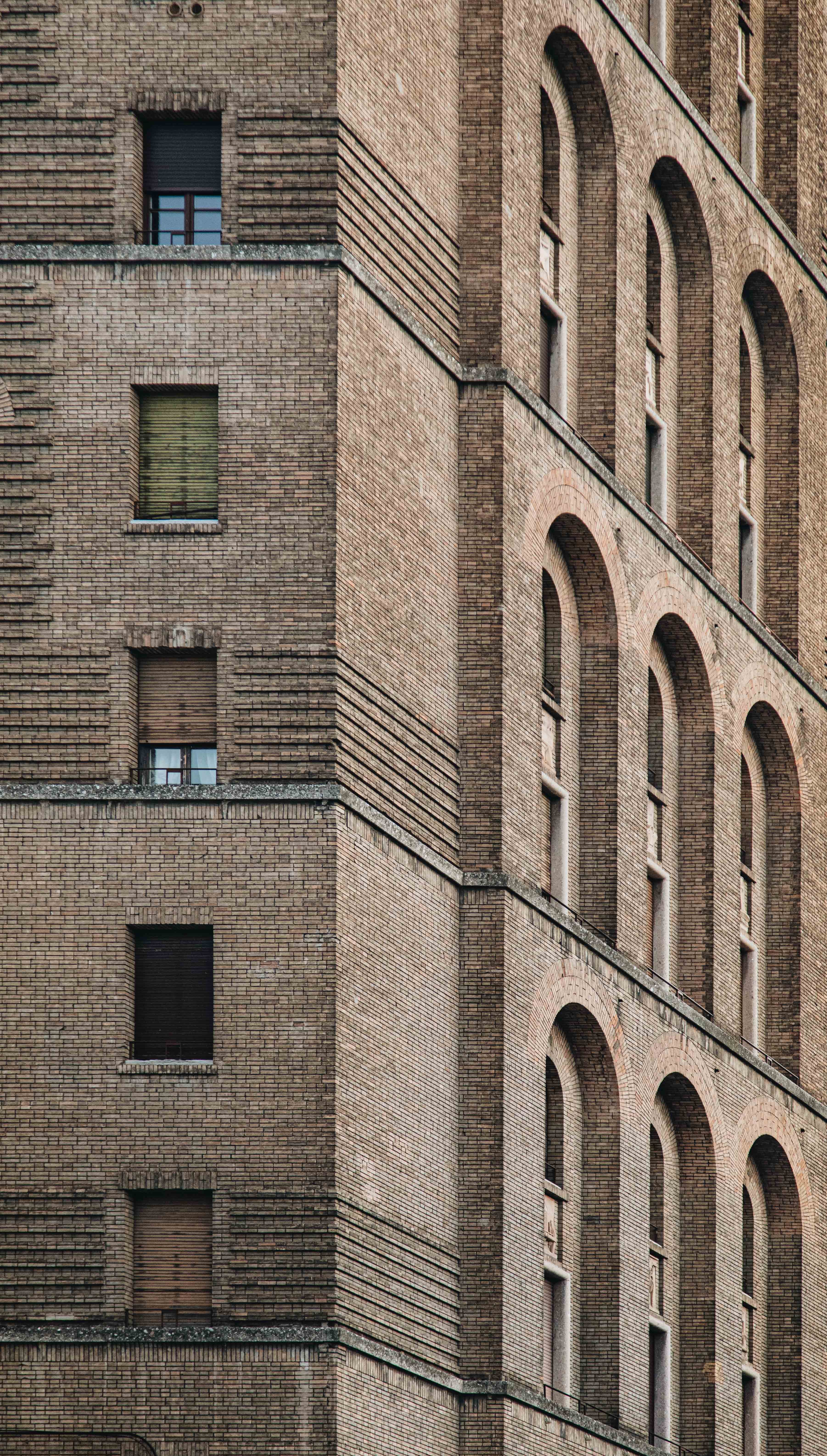 Stunning Close-Up Photo of Textured Brown Brick Building with Windows
