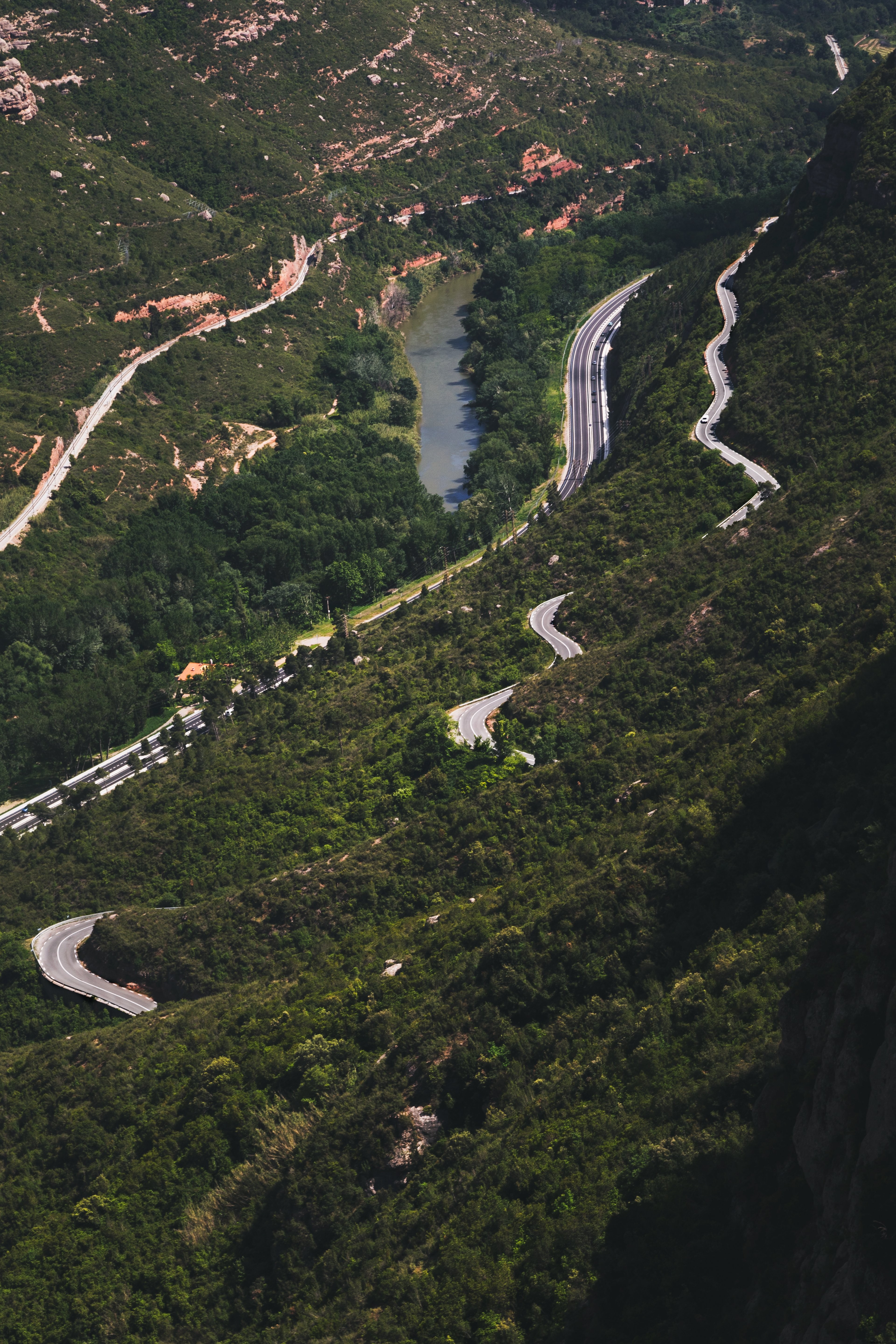 Stunning Aerial View of Winding Mountain Roads – Scenic Photography
