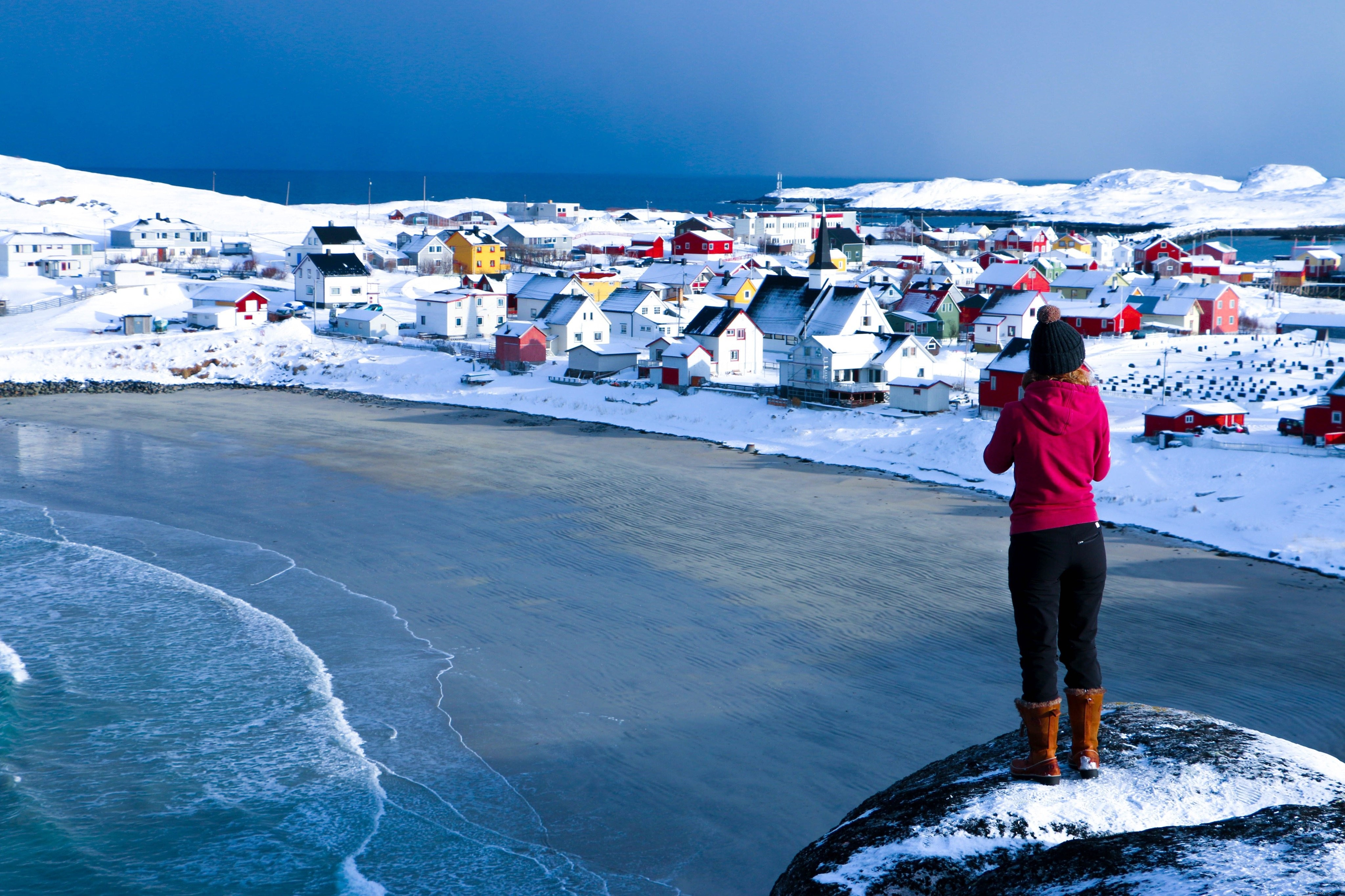 Majestic Cliff Overlooking Sandy Winter Beach with Vibrant Colorful Homes – Stunning Photo
