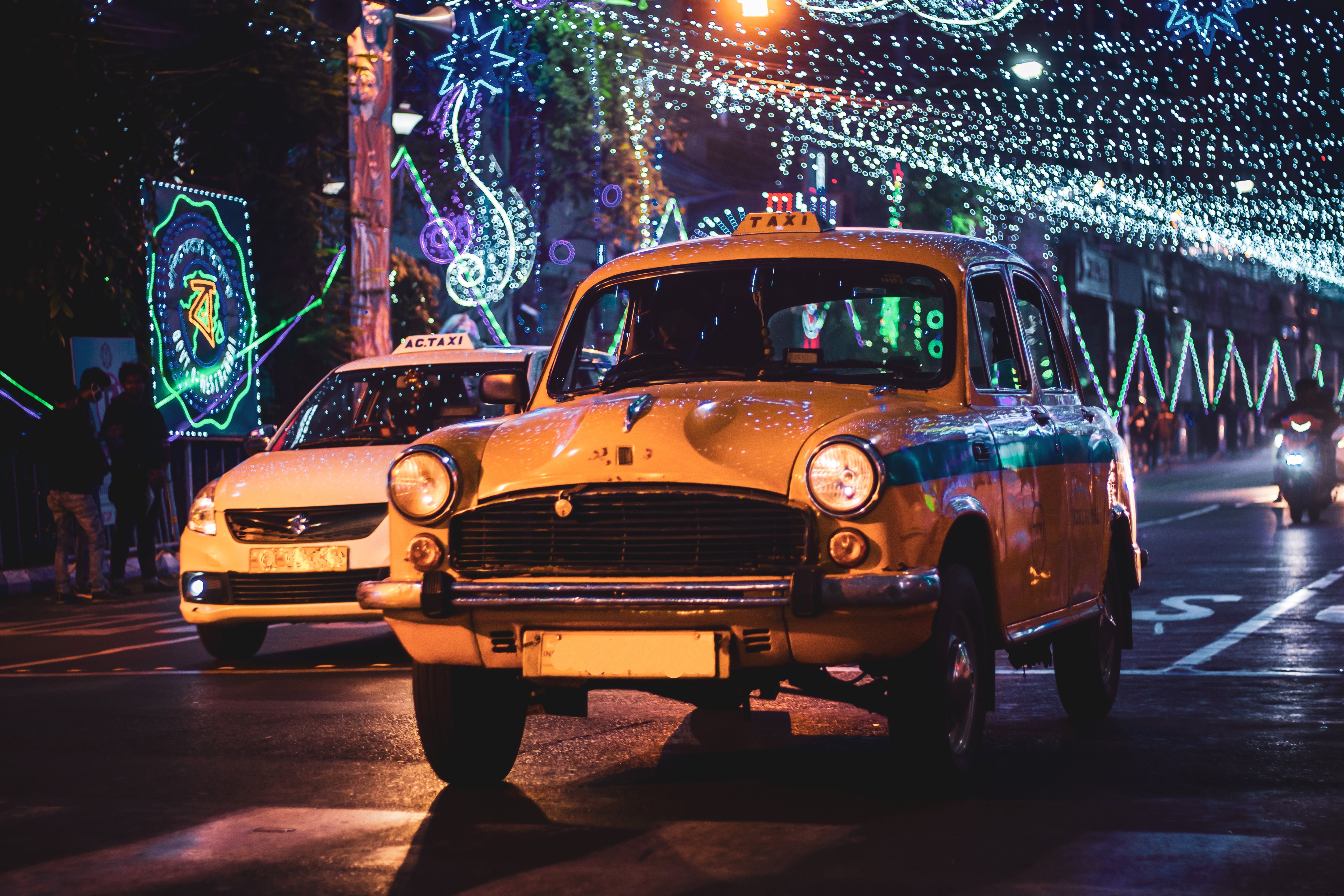 Stunning Night Photo: Taxi Roof Light with Festive String Lights