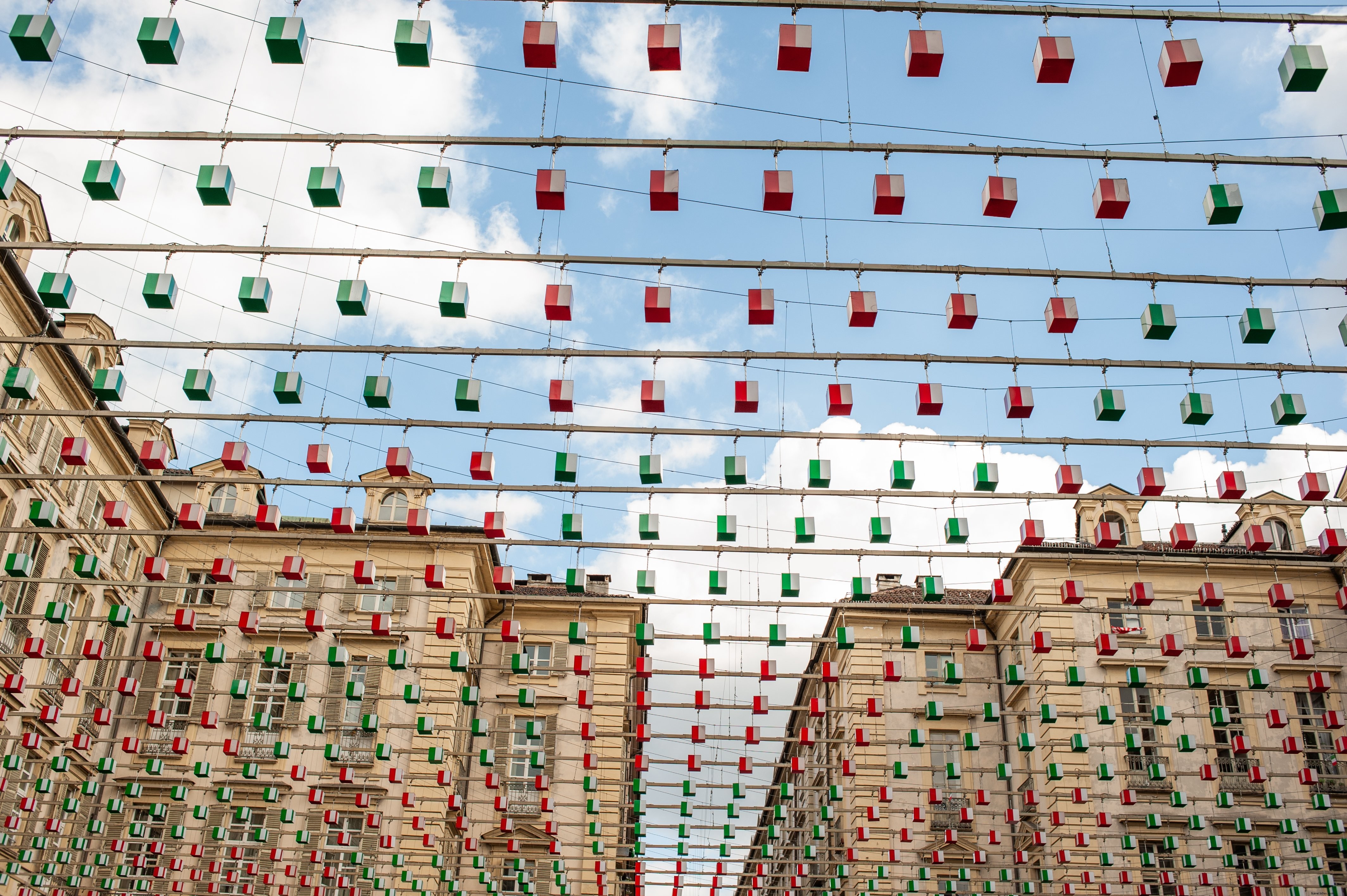 Stunning Photo: Hundreds of Vibrant Red and Green Lanterns Hanging Over a Bustling Street