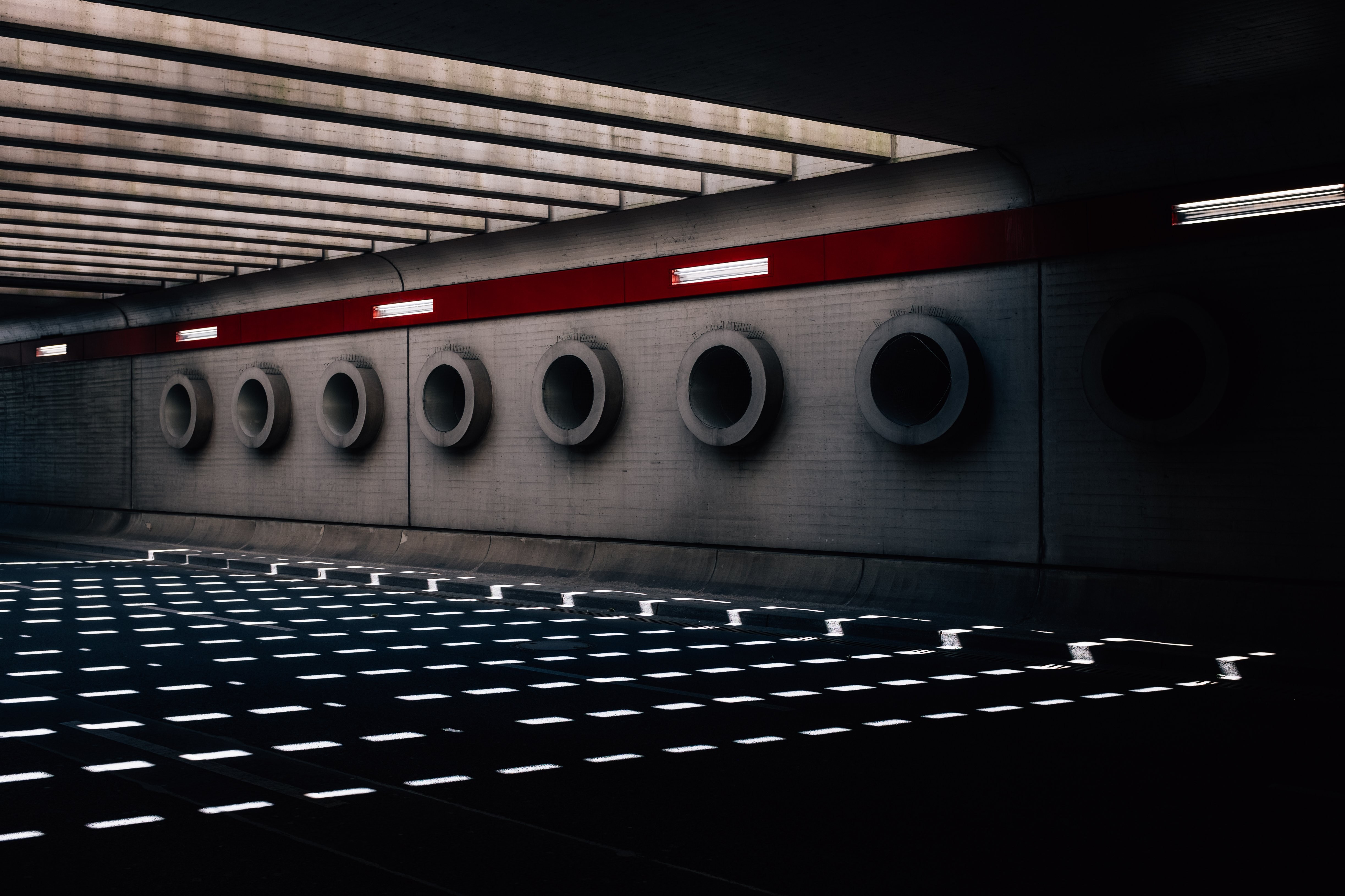 Stunning Sunlight Shadows Under an Overpass: Captivating Urban Photo