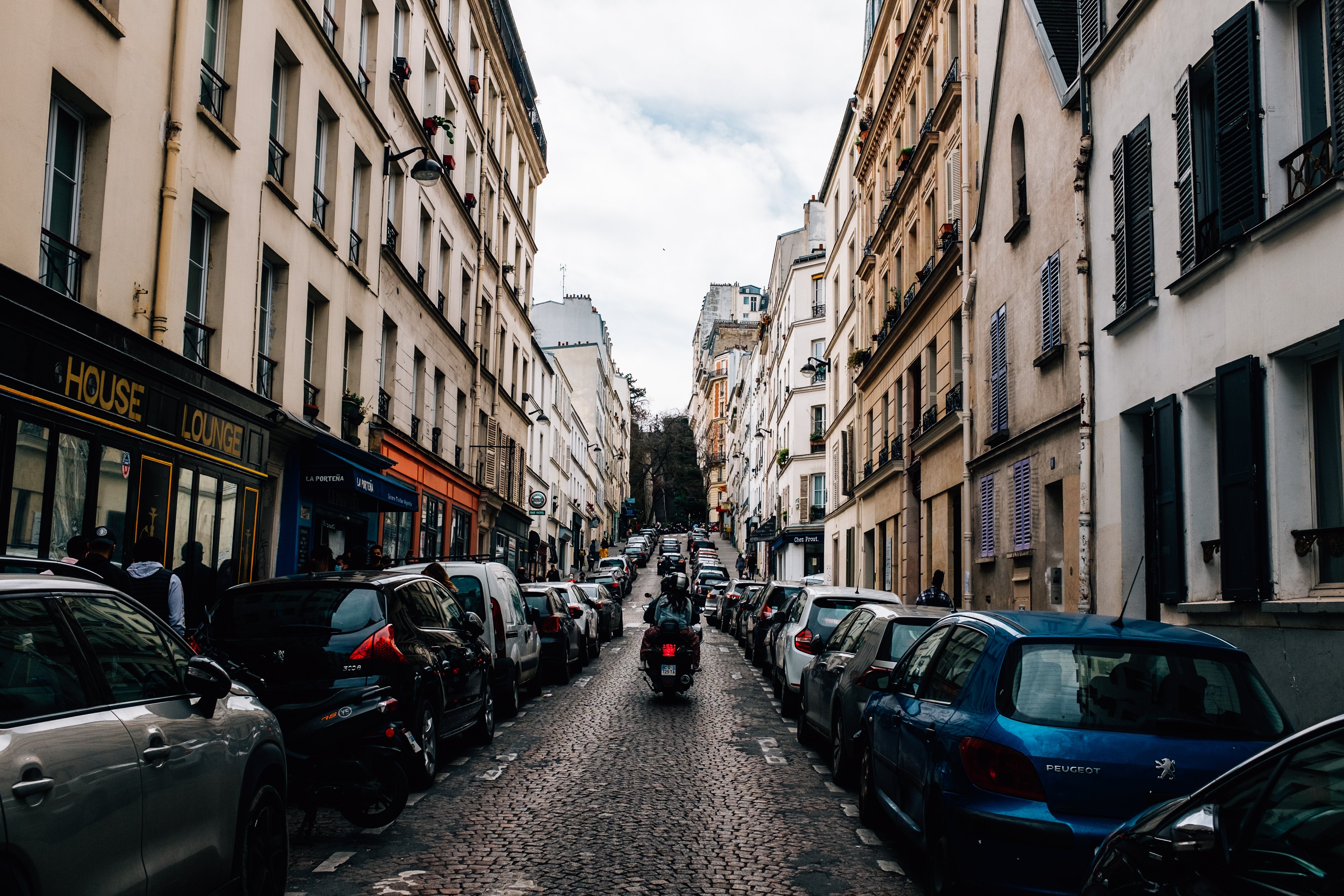 Thrilling Photo: Motorcycle Conquering Narrow Cobblestone Street