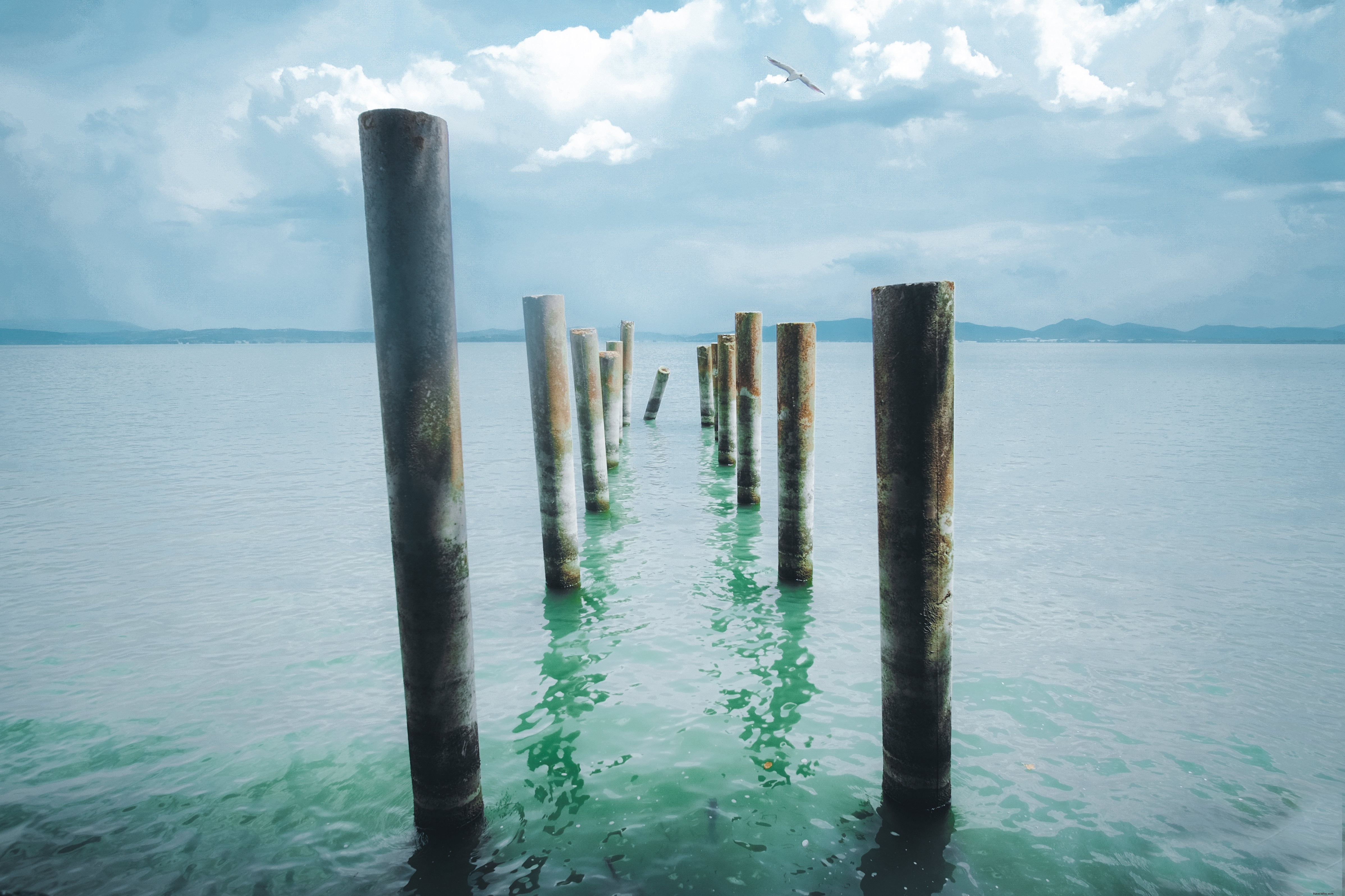 Stunning Seascape: Wooden Pegs Extending into Crystal Aqua Blue Waters