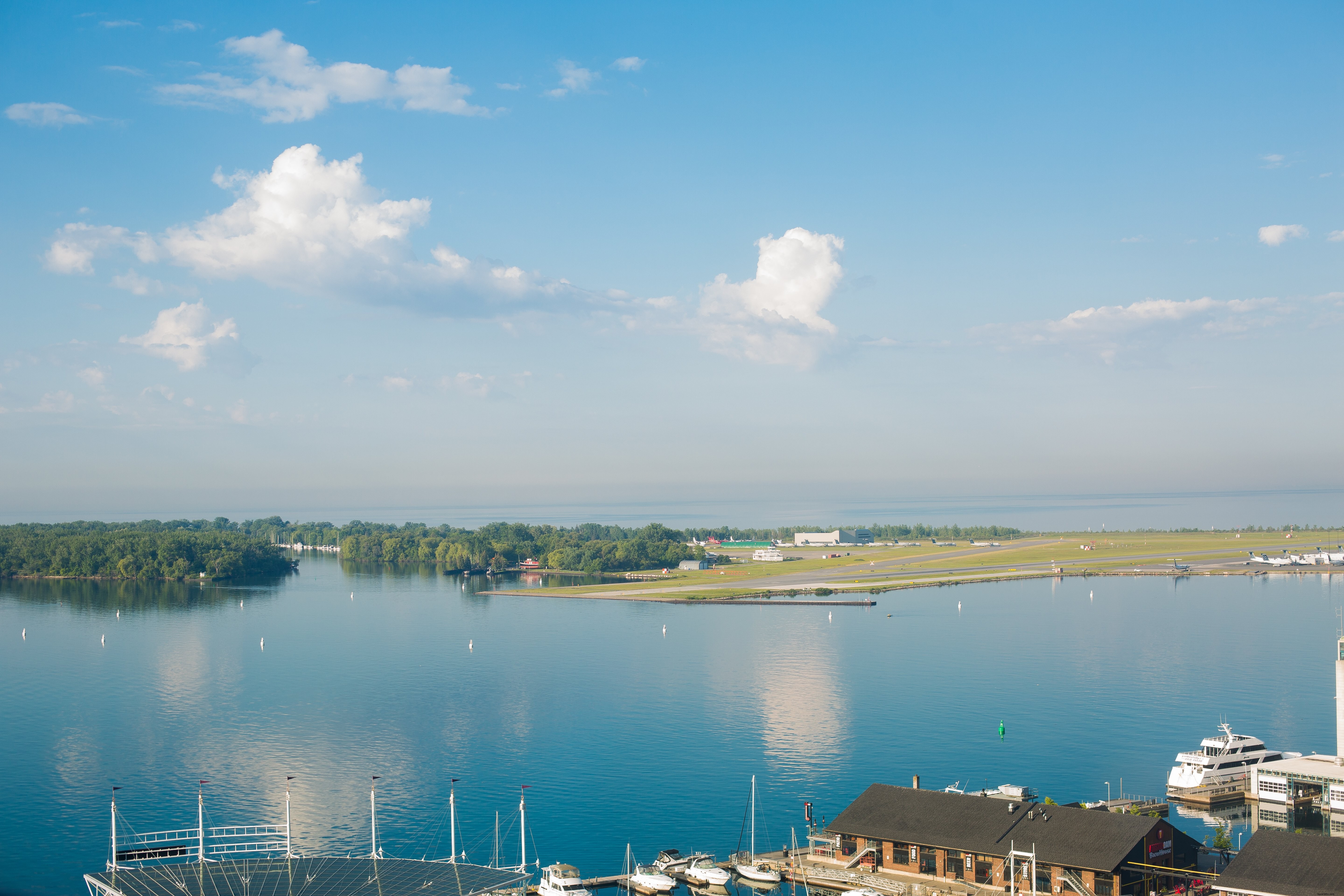 Stunning Panoramic View of a Marina and Island Airport