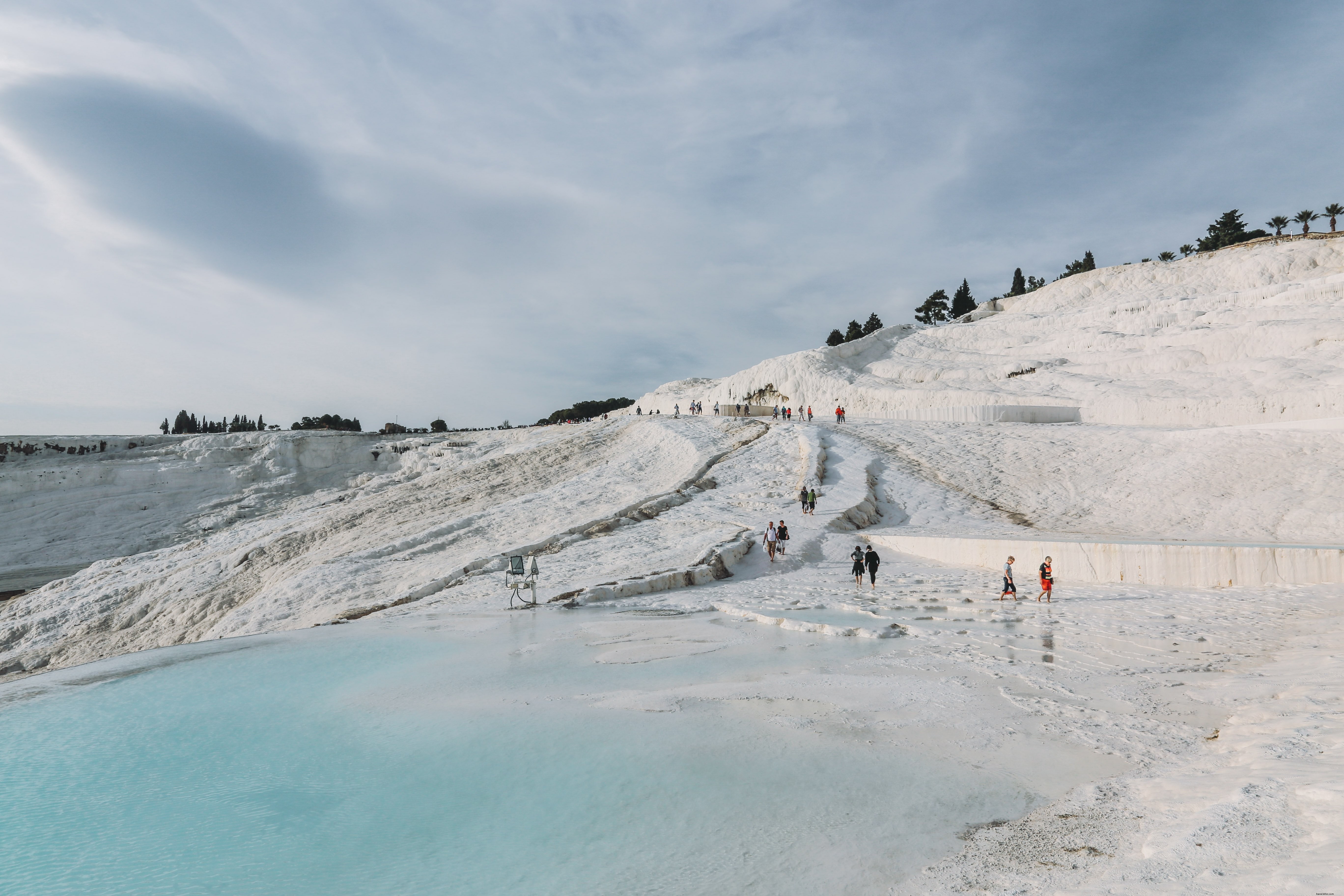 Stunning Photo: Visitors Relaxing in Scenic Thermal Pools