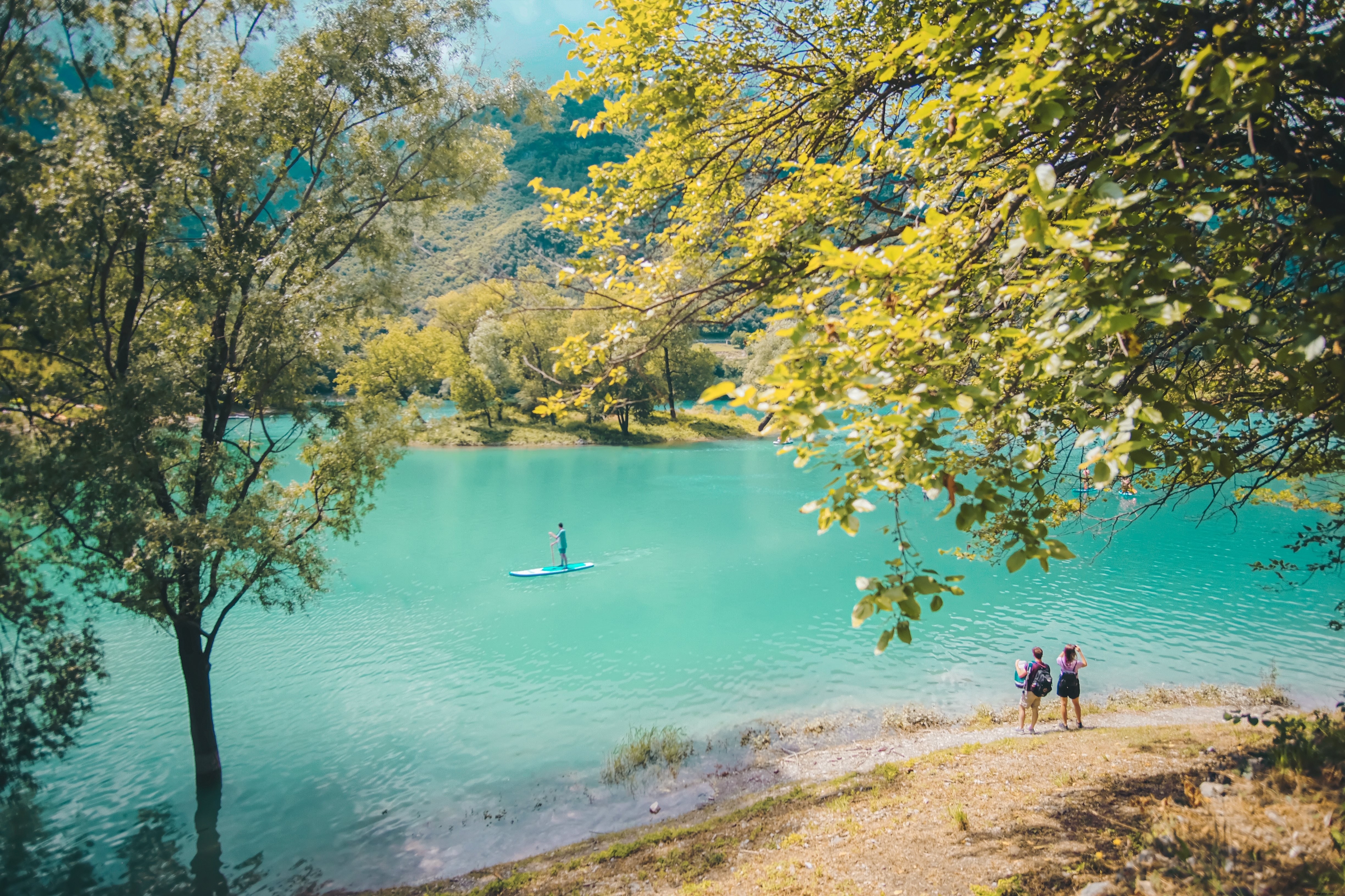 Stunning Aqua Blue River Framed by Lush Trees – Captivating Nature Photo
