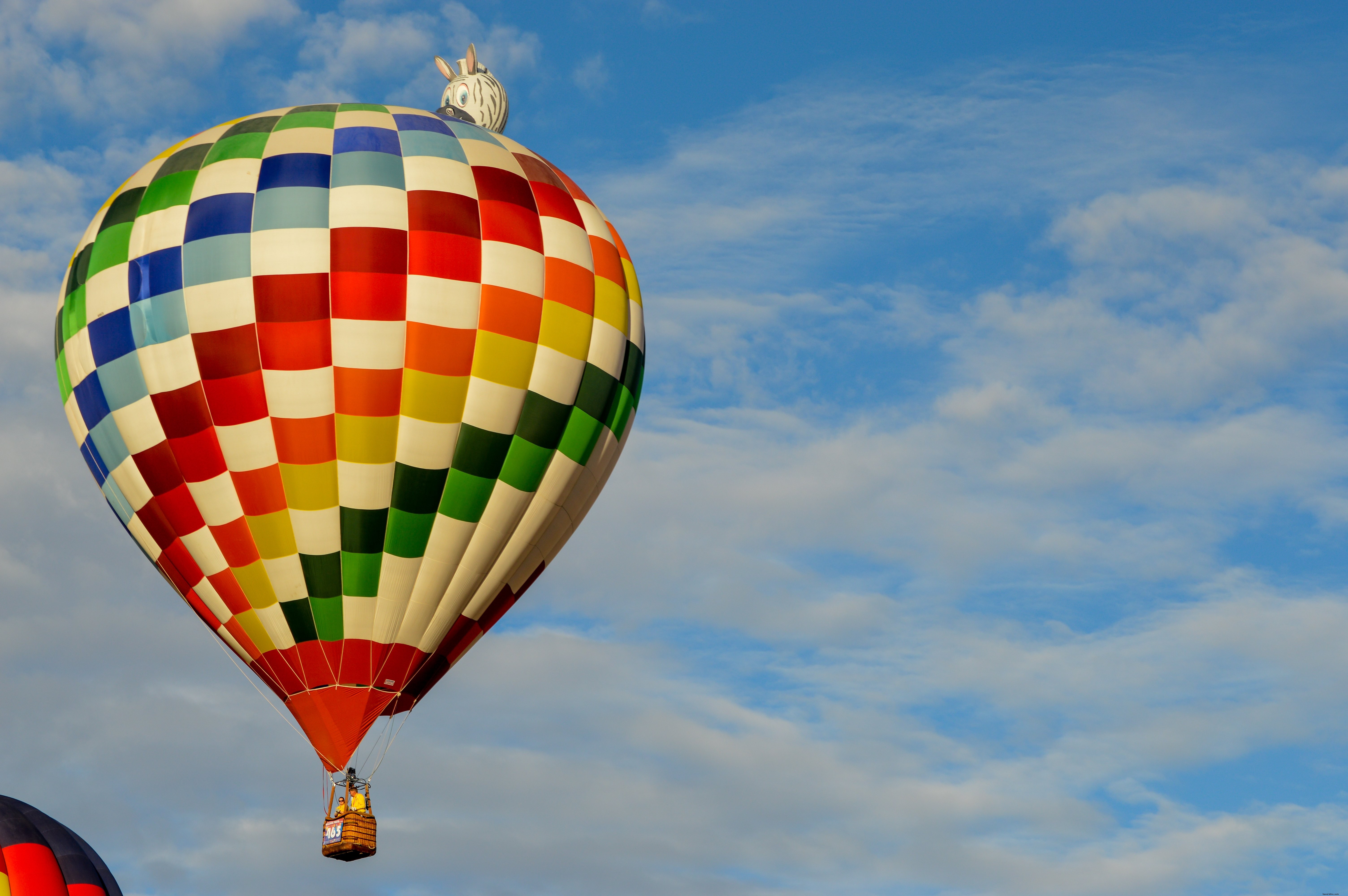 Stunning Colorful Hot Air Balloon Soaring Against Vibrant Blue Sky Photo