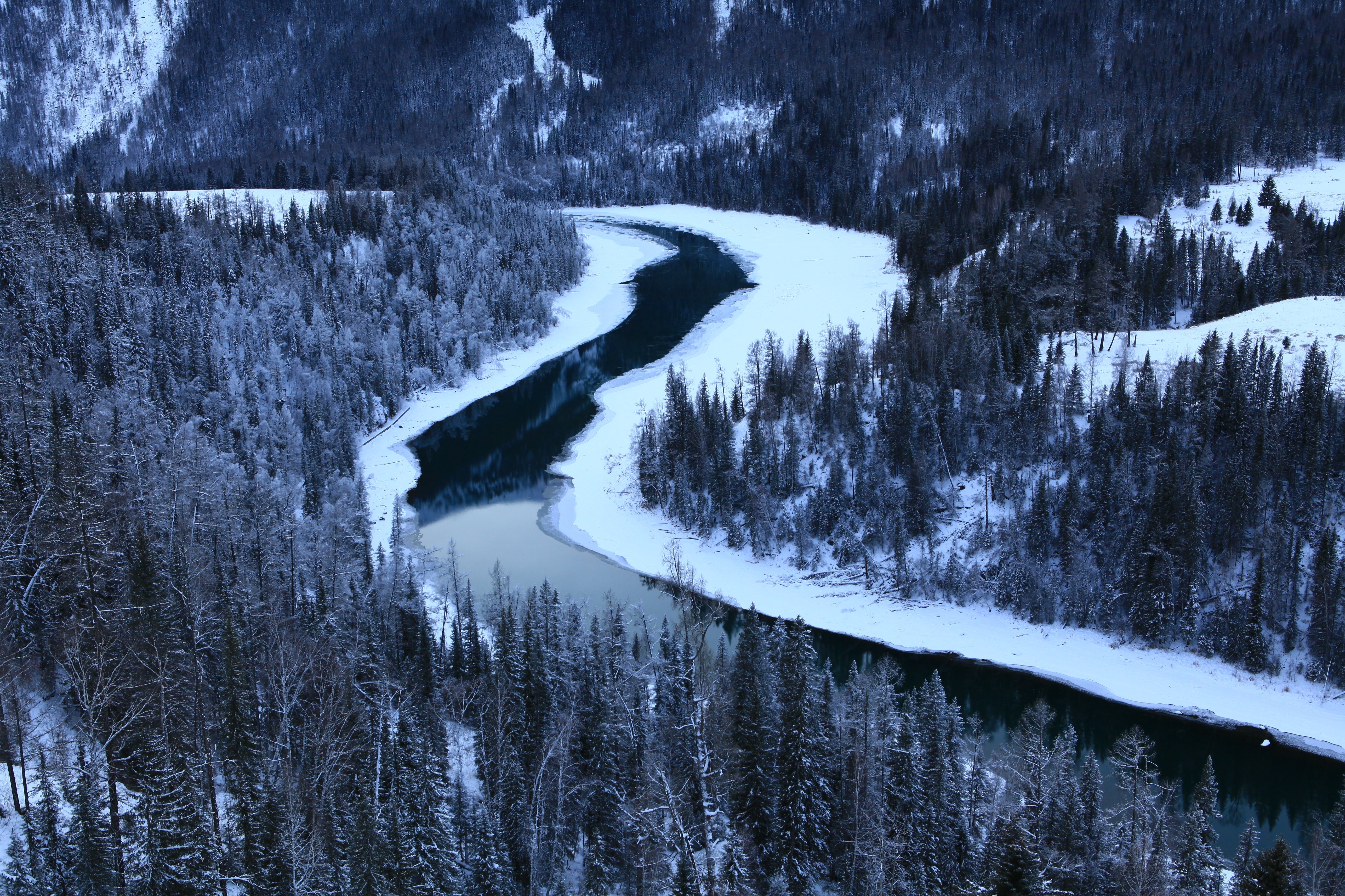 Breathtaking Winding River in Snow-Covered Forest – Stunning Winter Photo