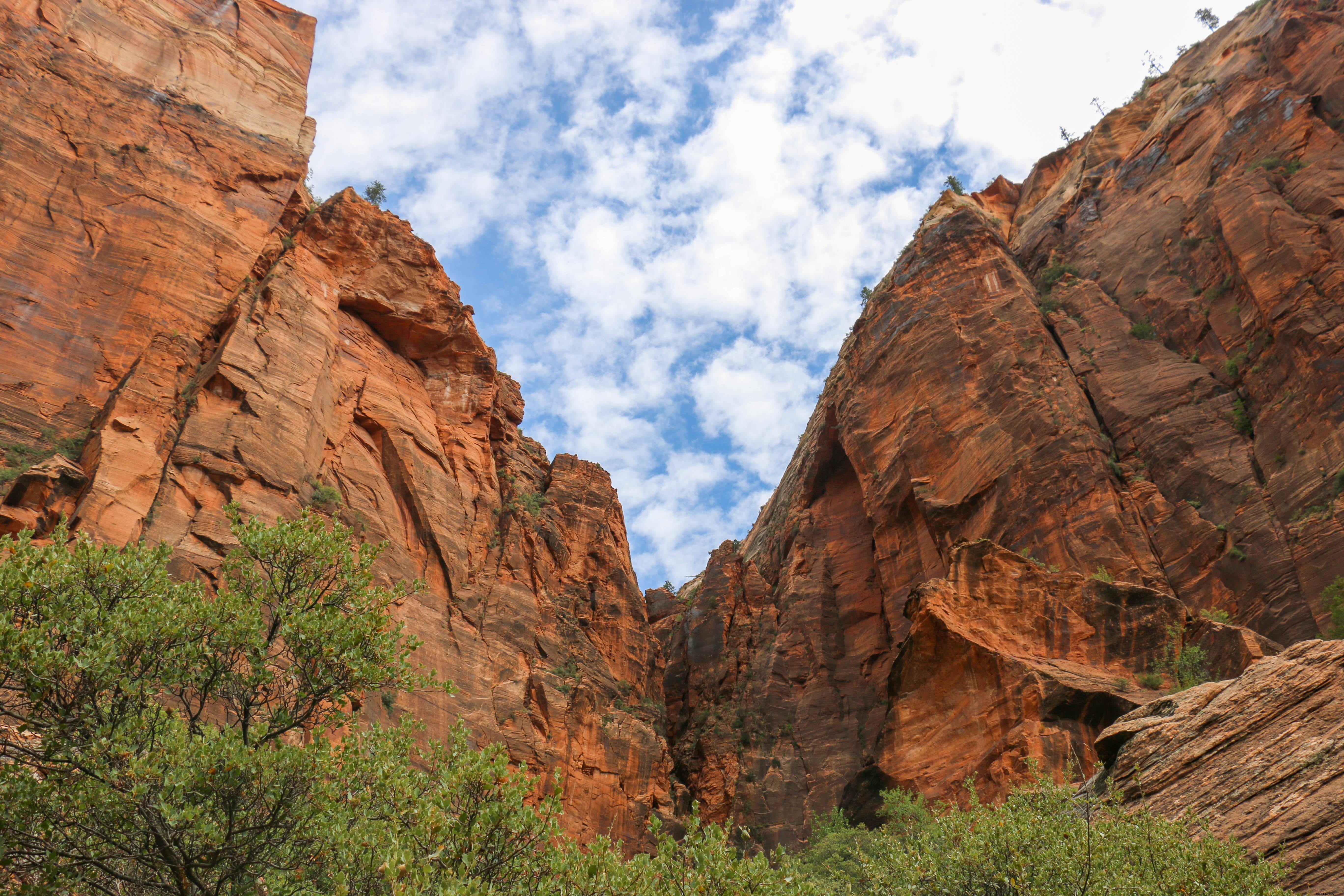 Stunning Landscape: Rich Blue Cloudy Sky Over Dramatic Steep Valley